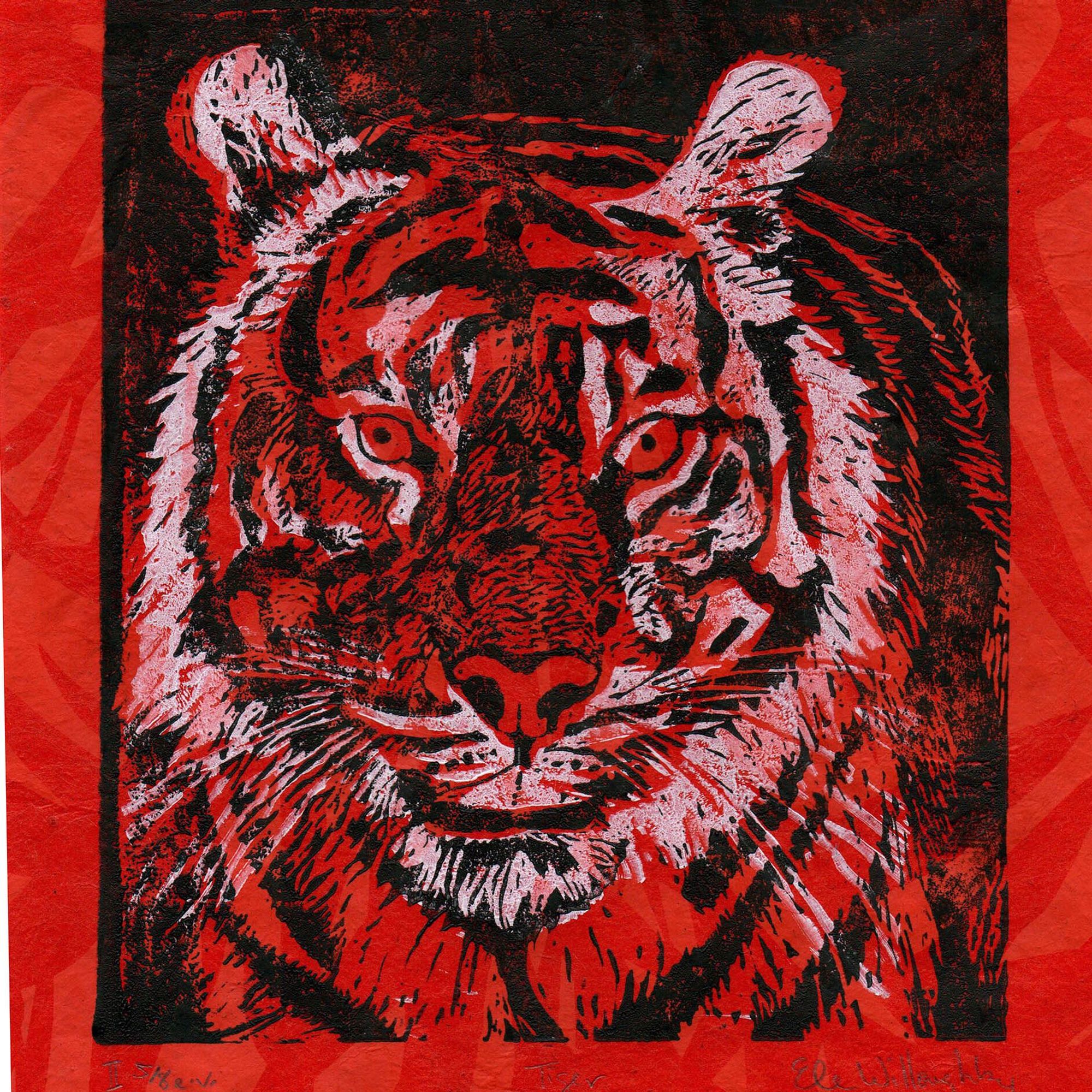 My linocut print of a tiger’s face printed in white and black ink on orange paper with a darker red-orange leaf pattern