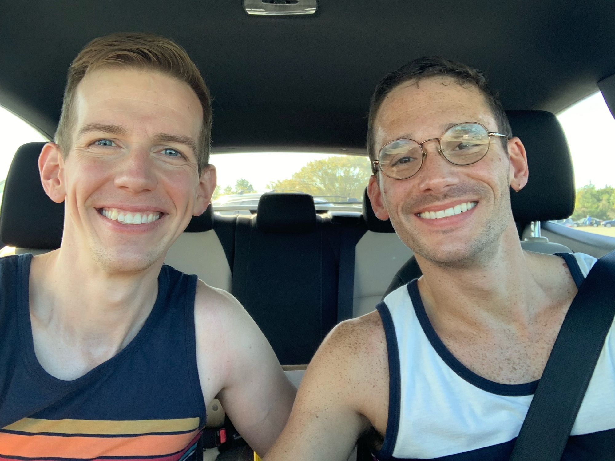 Two homosexuals in the car after the beach 🏖️ wearing the shirts they purchased from their local boutique Target #notsponsored