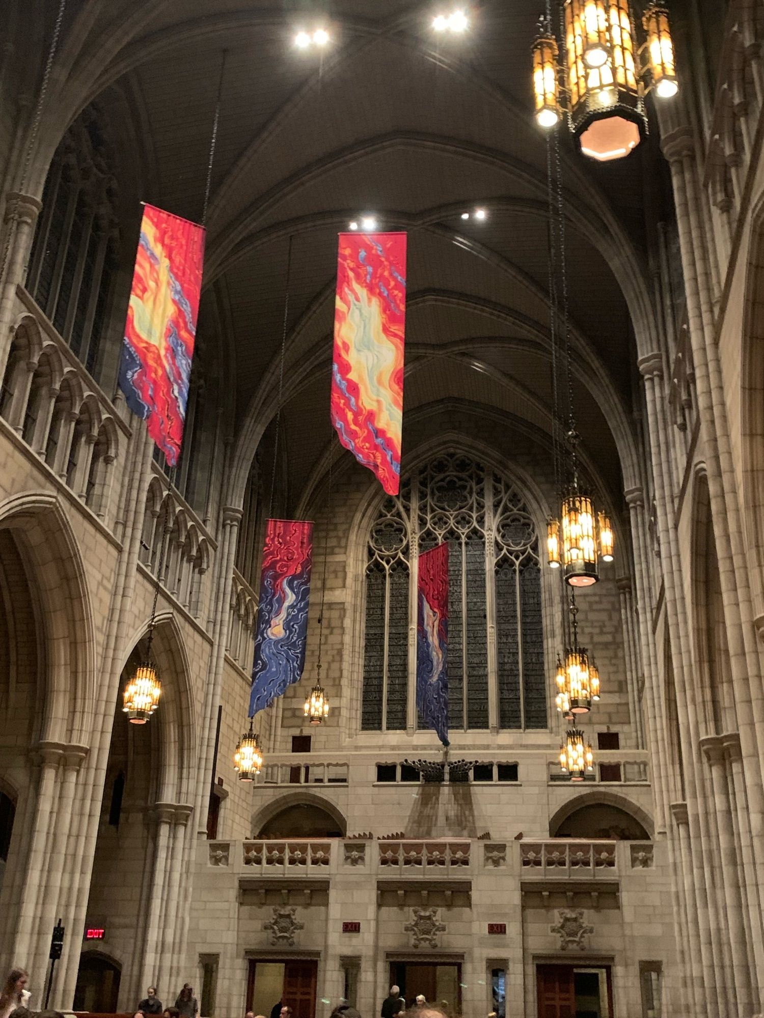 The back of the cathedral, featuring its extremely high (>9 ft, rich) ceilings.