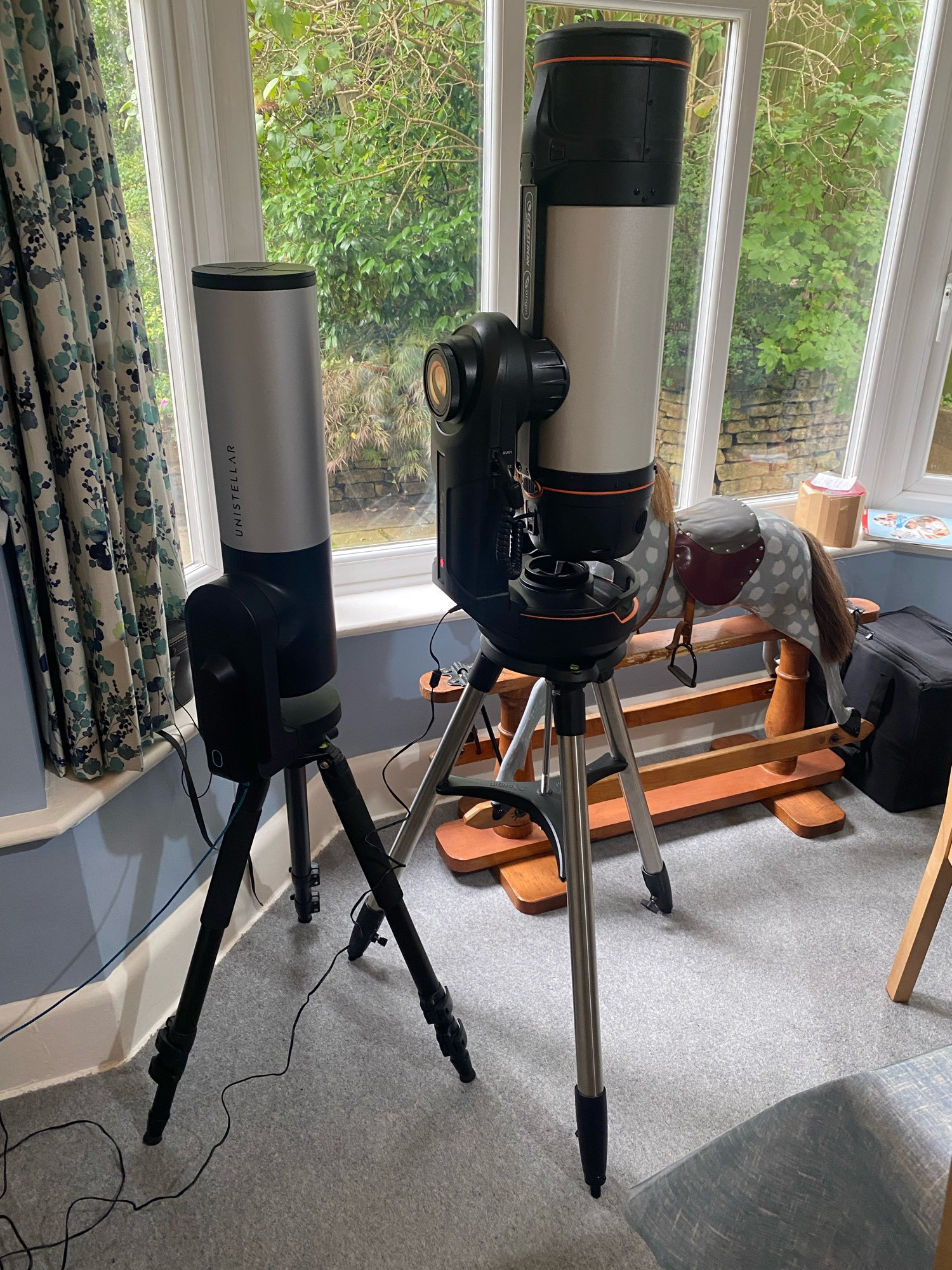 4-year-old Unistellar eVscope next to shiny new Celestron Origin