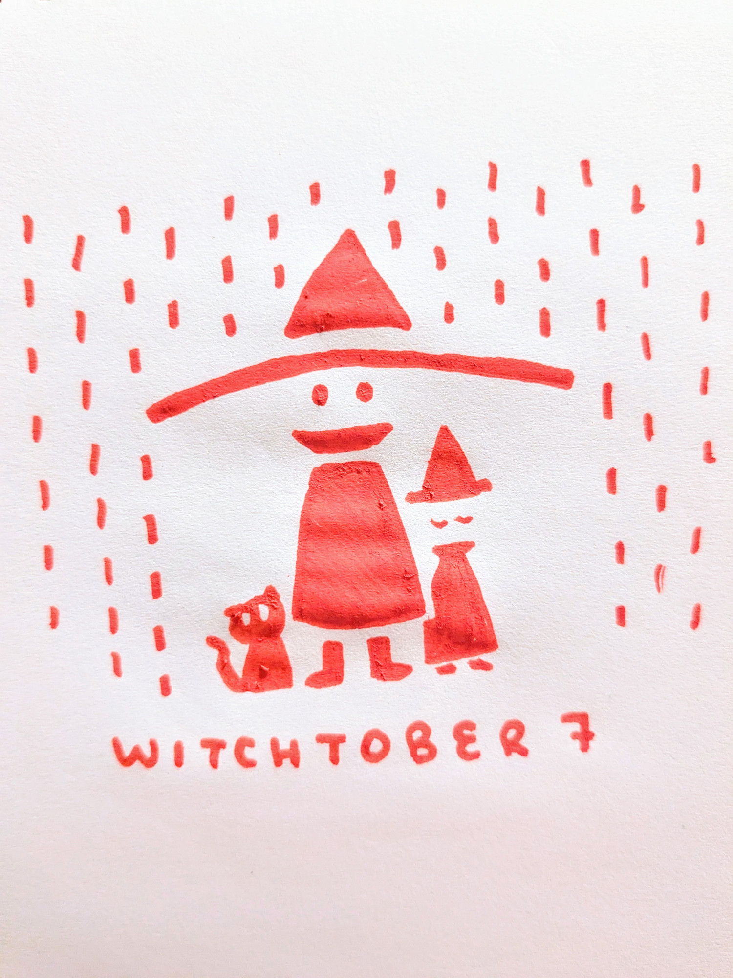 red marker drawing of witch with wide brim hat protecting cat and smaller witch from the rain