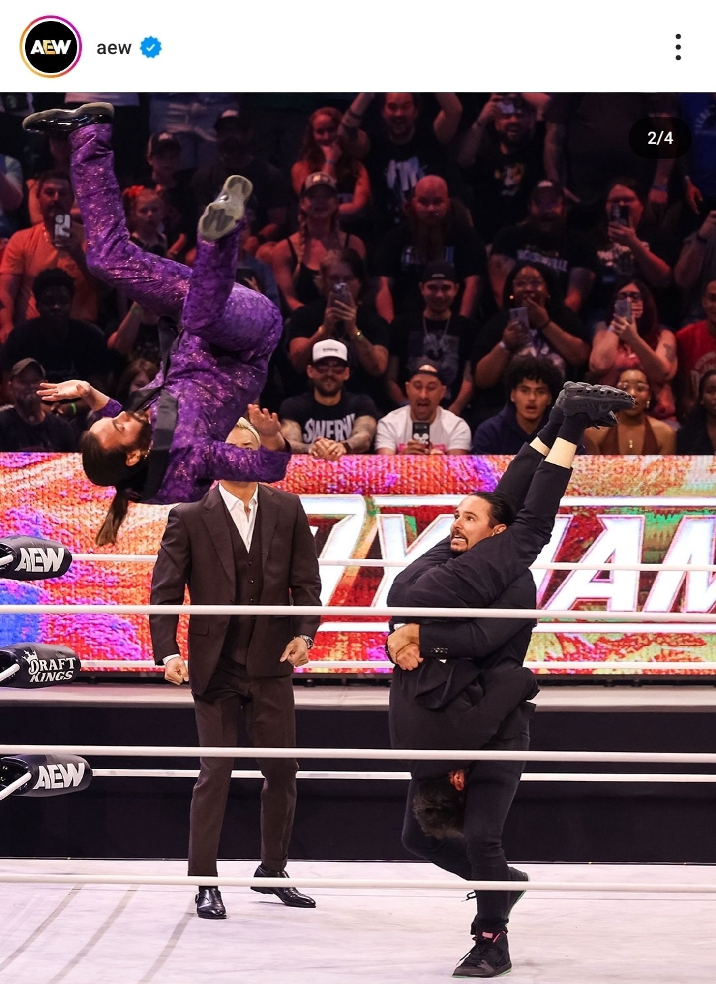 A picture from AEW Instagram that shows wrestlers The Young Bucks performing a move on Tony Khan. One of them is holding Tony upside down while the other is in mid-flip off the top rope.