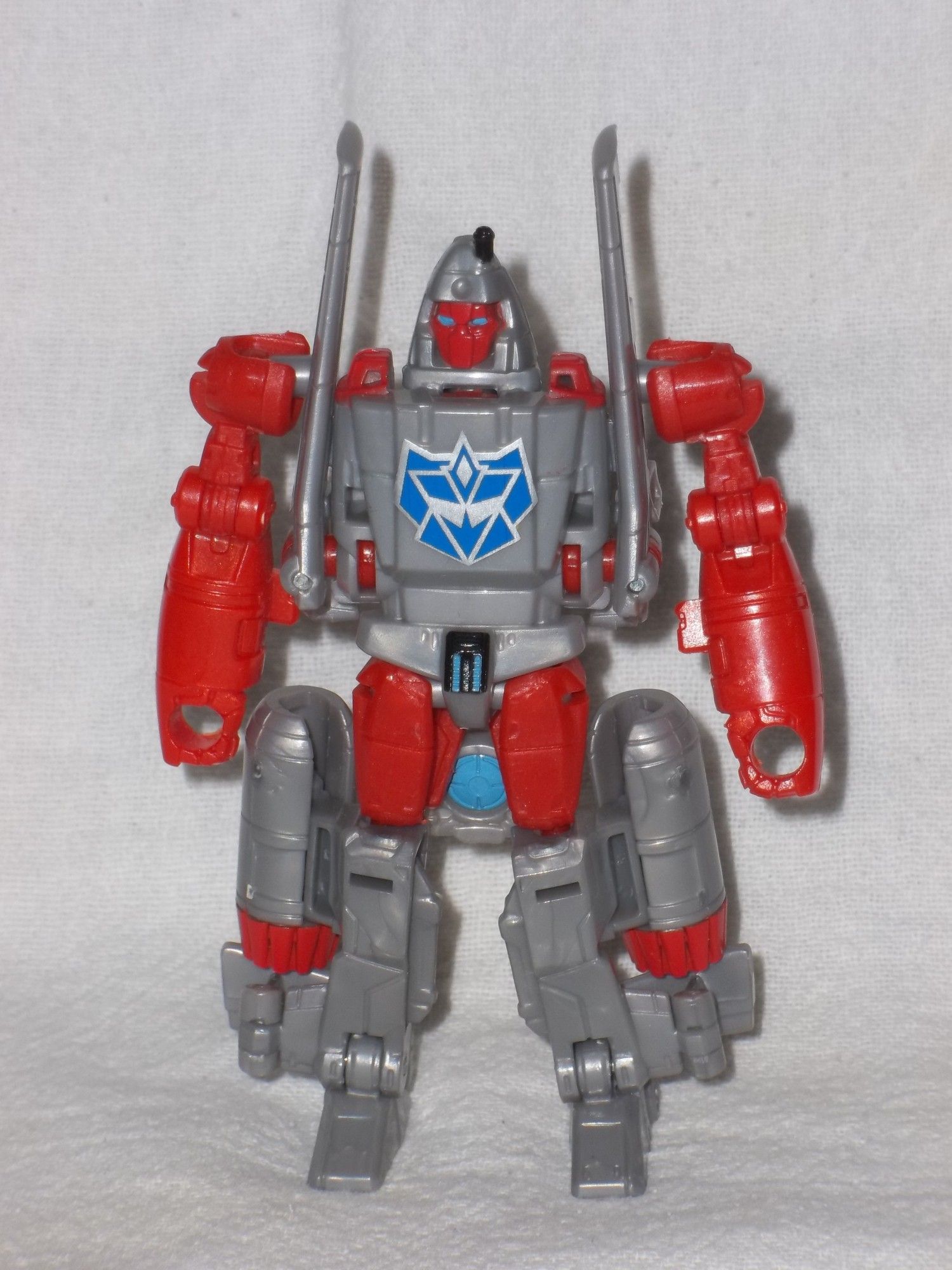 A Transformers Combiner Wars G2 Style Powerglide action figure, in robot mode, with a custom blue G2 Decepticon symbol on its chest.