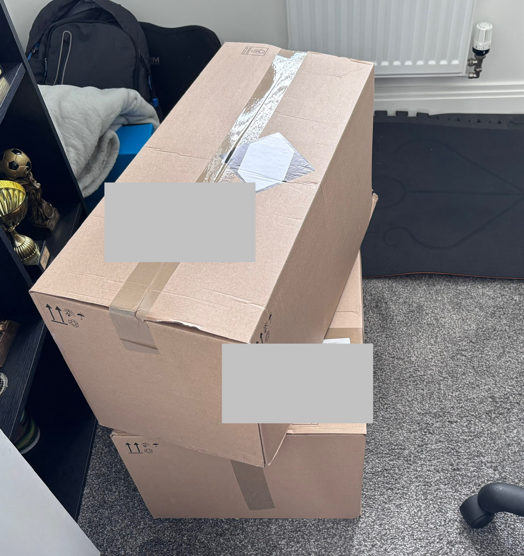 Two large boxes on the floor. Each box is full of prescription items, total about 15 to 20 kg.