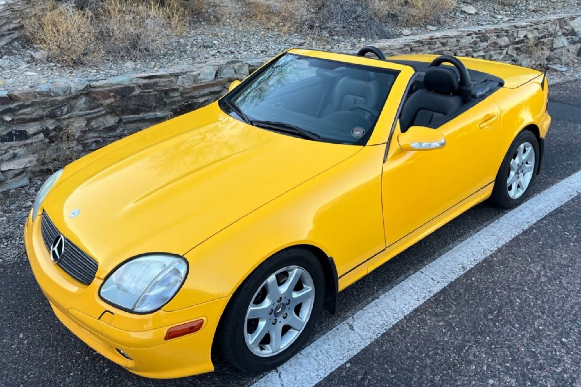 A yellow SLK320 listed on Bringatrailer