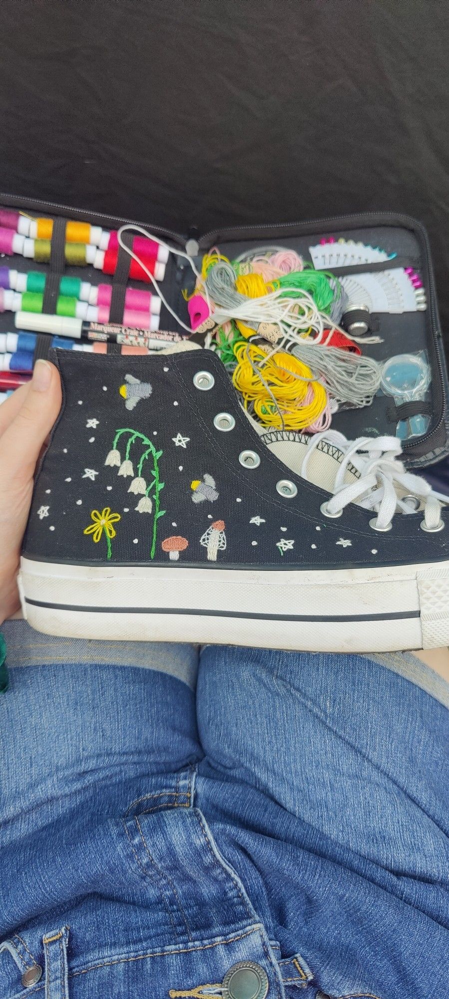 Converse shoe with hand embroidered flowers, mushrooms and fireflys with starts and white dots