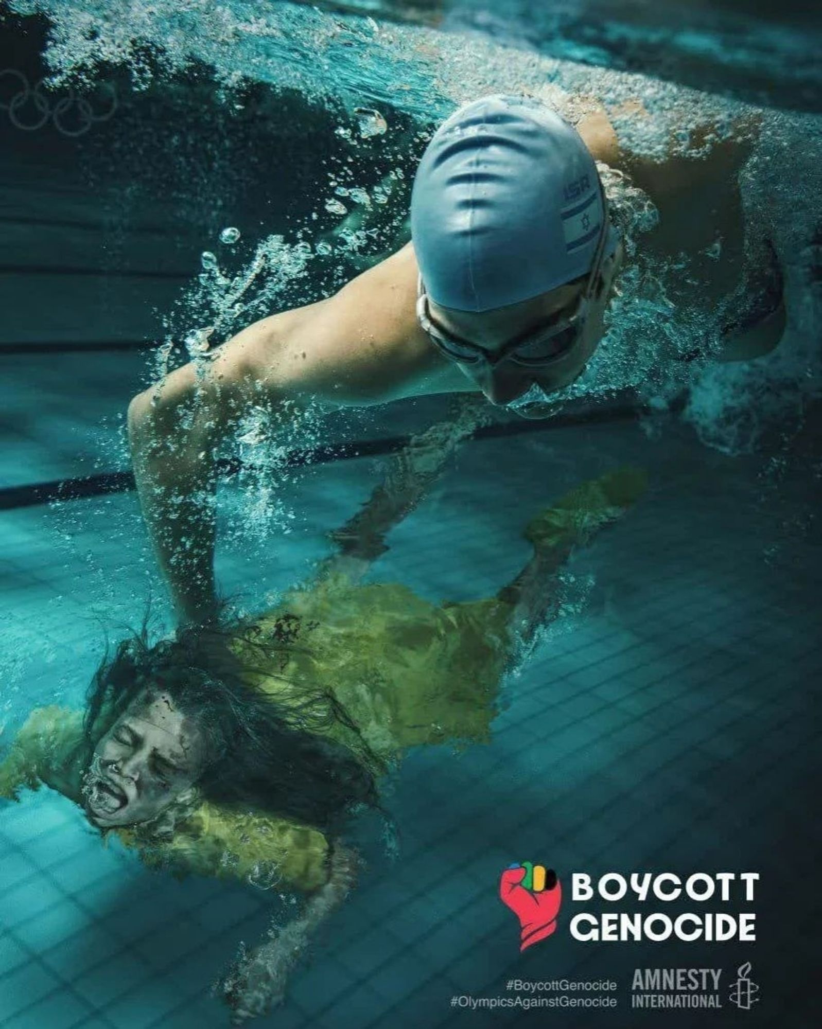 An Israeli swimmer holds a drowning child under the water