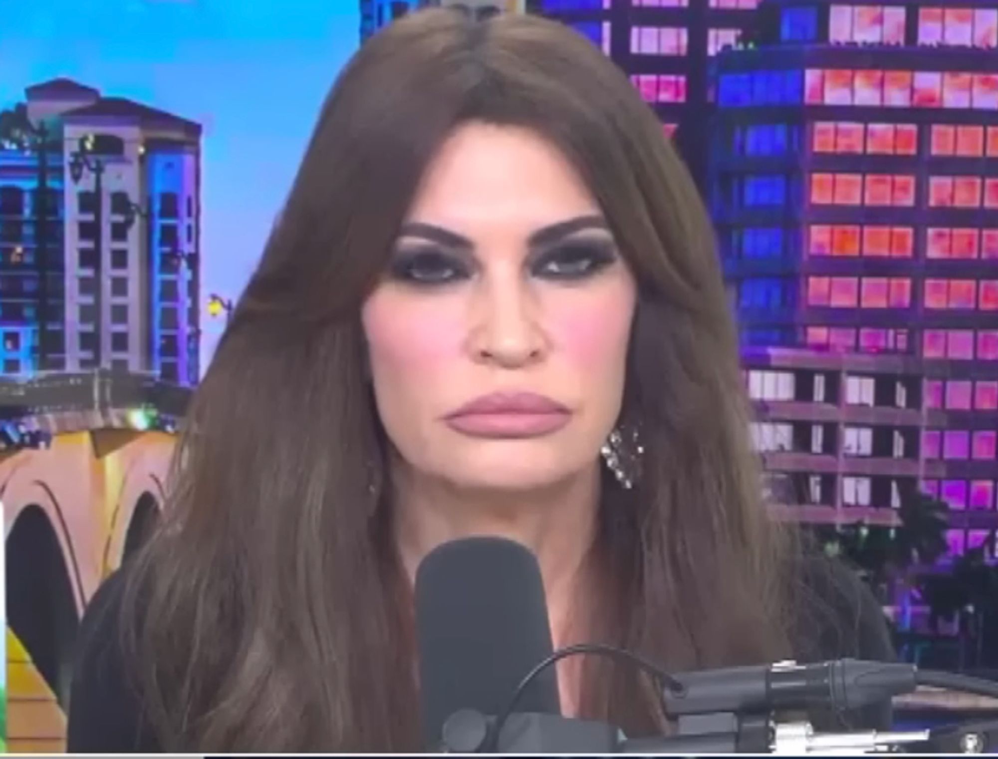 sreenshot of kimberly guilfoyle, whose extremely heavy makeup and I guess lip fillers? are making her look like something created by a.i.