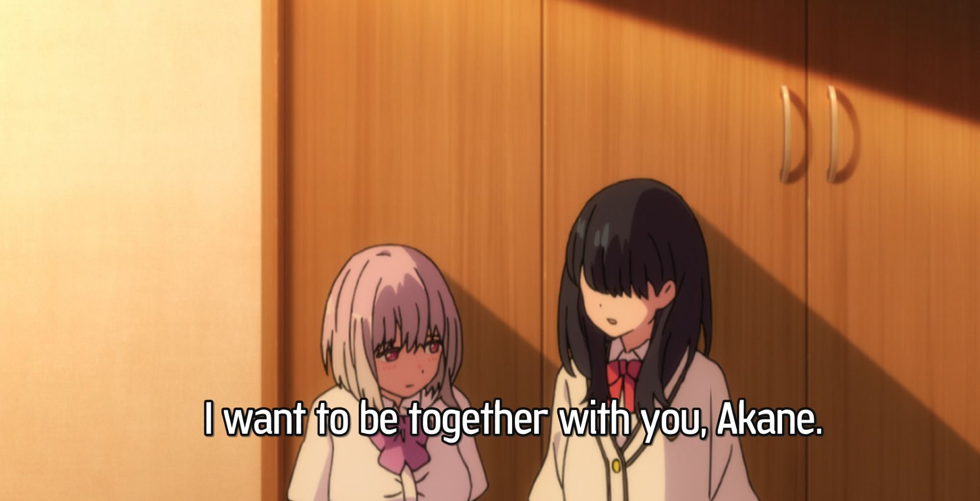 Rika turns towards Akane while they hold hands and says, "I want to be together with you, Akane."