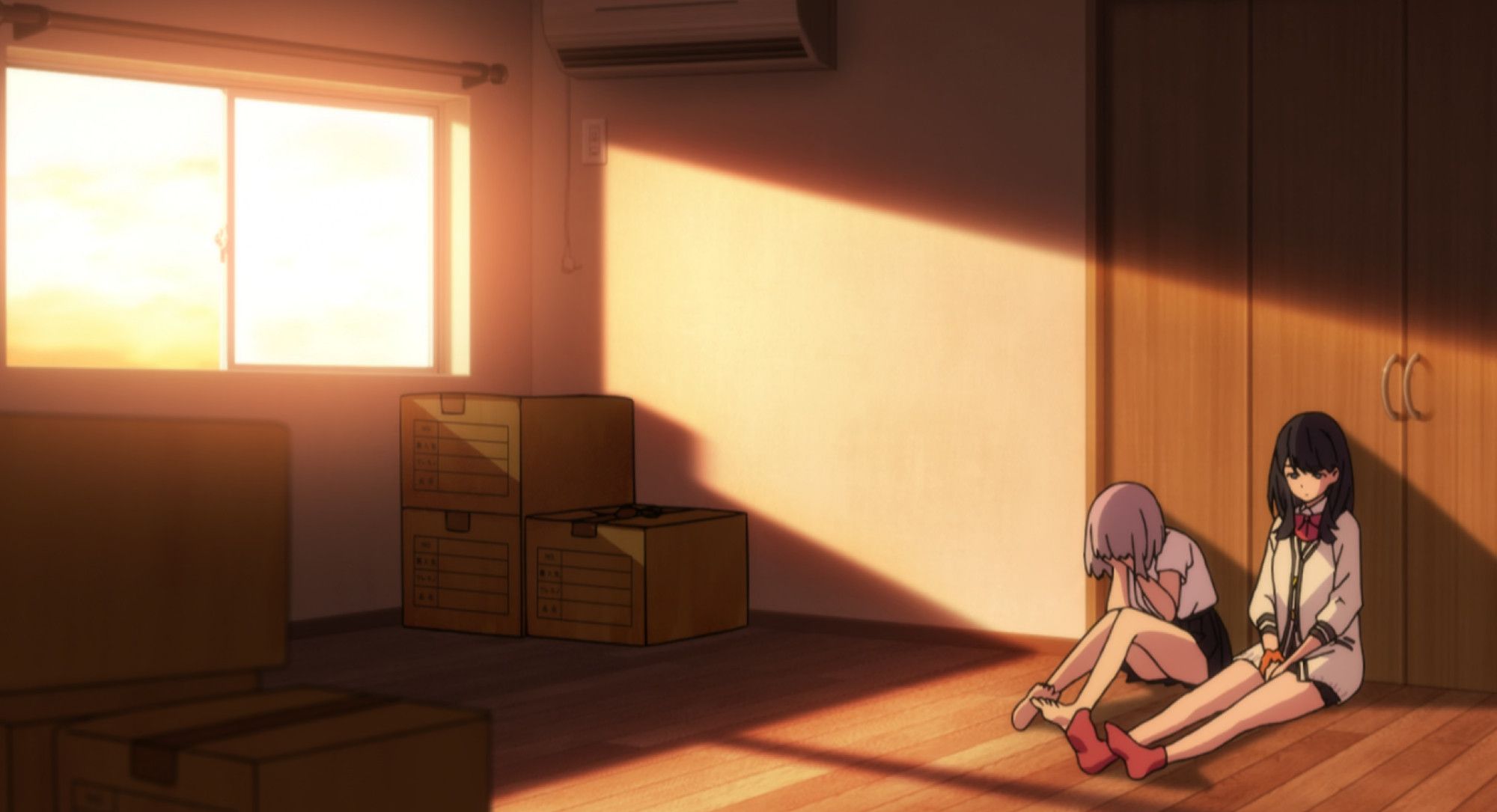 akane crying all over the hardwood floor, while rika sits next to her and keeps her company.