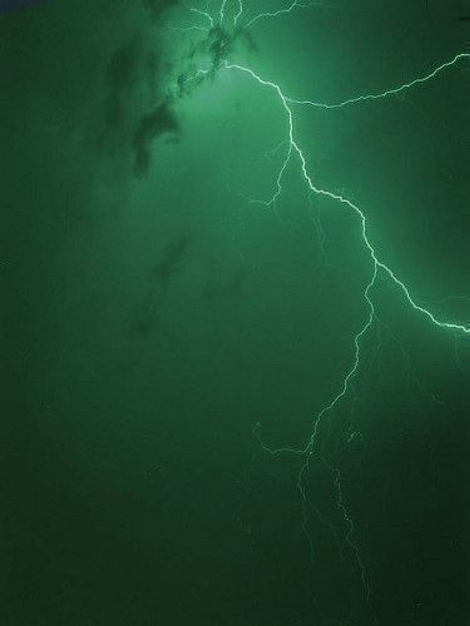 Lightning striking with a green background 