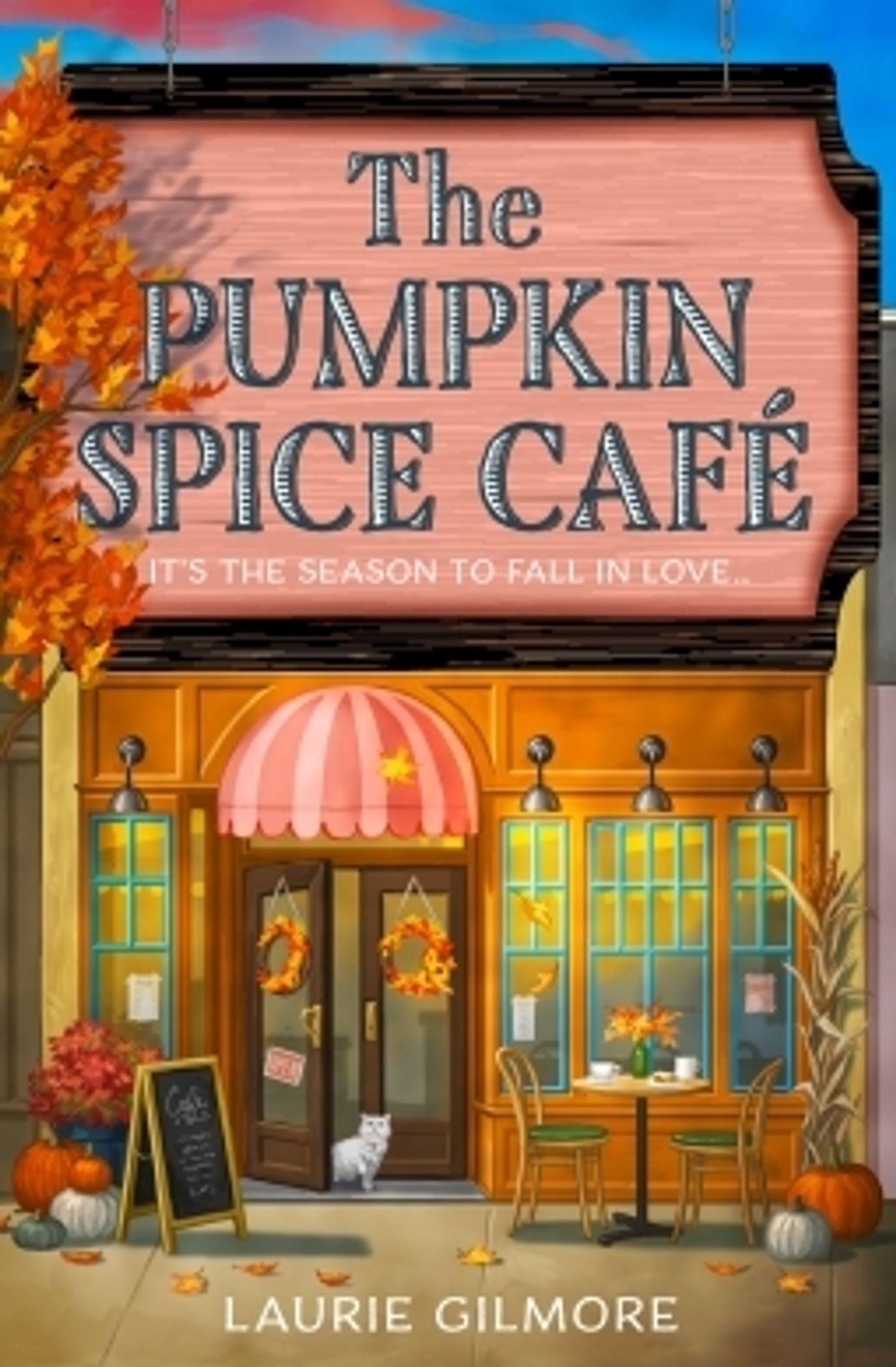 cover of the book The Pumpkin Spice Café by Laurie Gilmore, featuring the front of the cafe. orange and red leaves on the tree. "it's the season to fall in love"