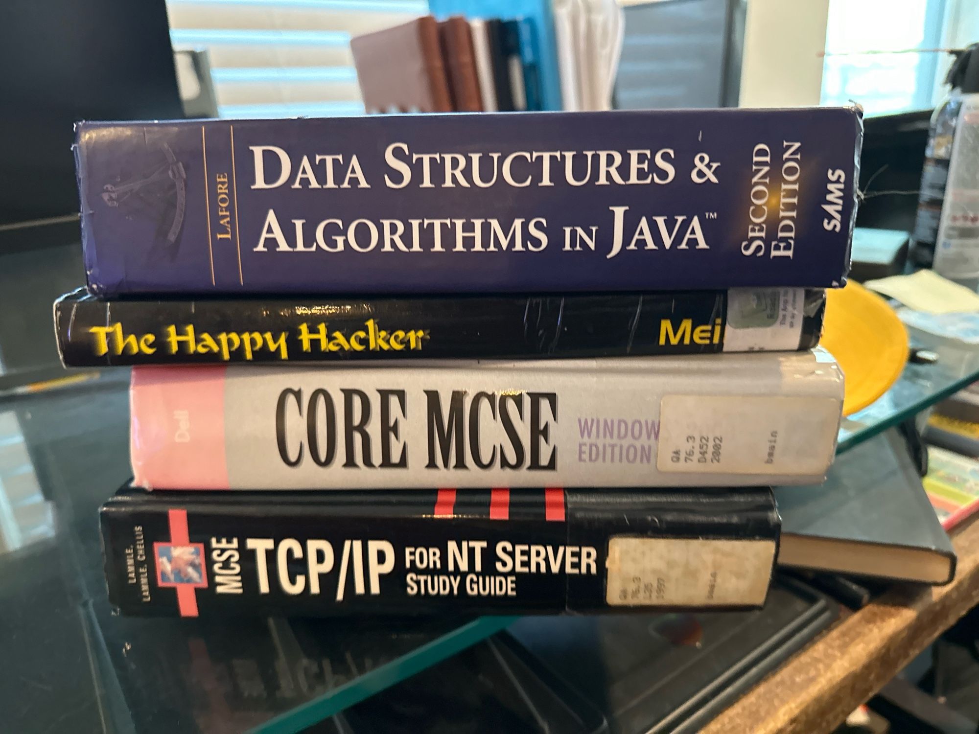 Photo of 4 books. 
Data Structures & Algorithms in Java by Lafore 
The happy hacker by meinel
Core MCSE by dell, and
MCSE TPC/IP for NT Server Study Guide by Lammle