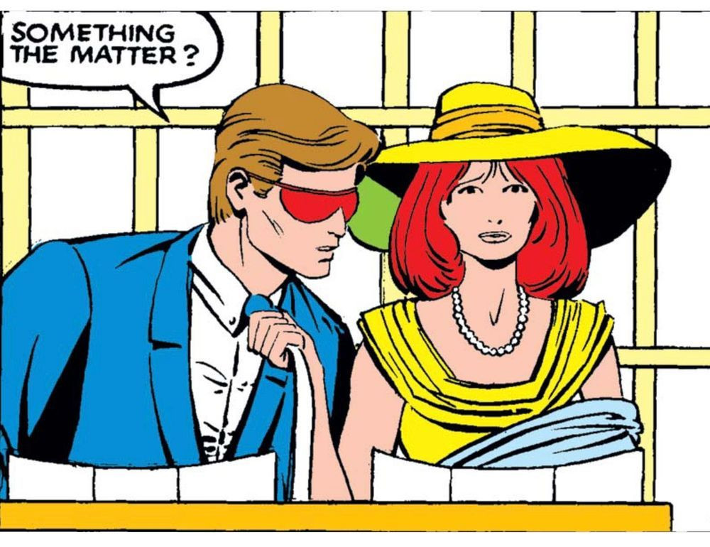 Scott Summers and Madeleine Pryor are in a restaurant with menus in front of them. Madeline stares straight forward with a worried look on her face and pulls Scott by his neck tie closer to her. He leans in and asks, “Something the matter?“