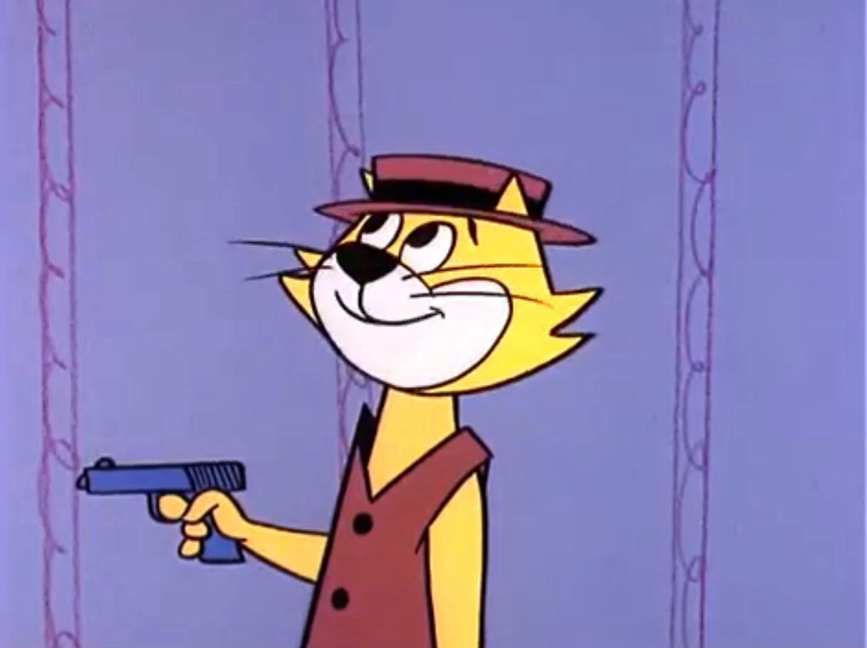 The recurring image on this feed of Top Cat indoors, standing alone in front of a wallpapered wall as he looks upward towards the post copy above, his smile tight, while holding a handgun towards the left side.