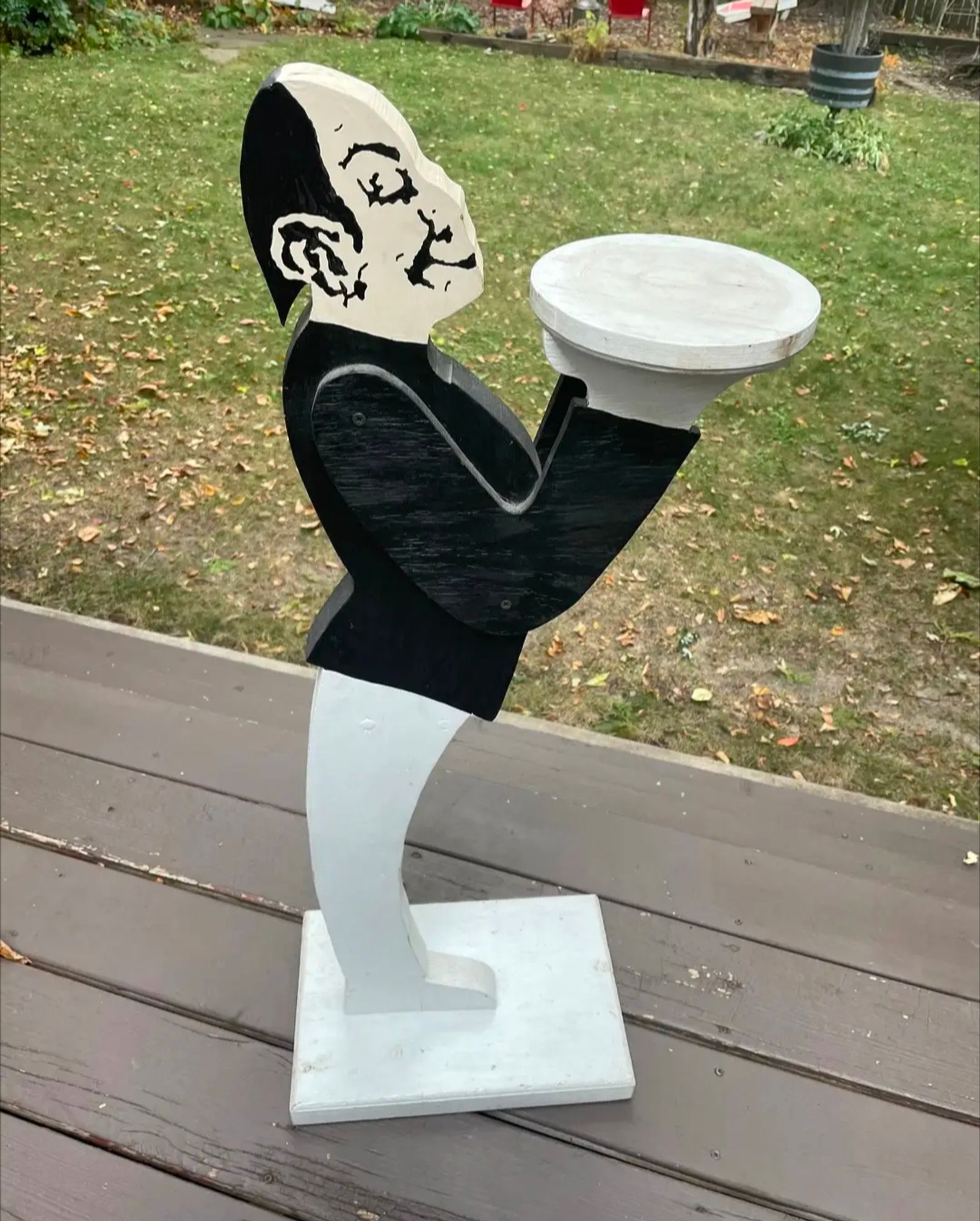 This vintage folk art dumb waiter is hand made and hand painted and is in good, sturdy, vintage condition. No wiggles. The white painted areas show stains and wear and could use a fresh coat of paint. He measures approx 37" tall. 