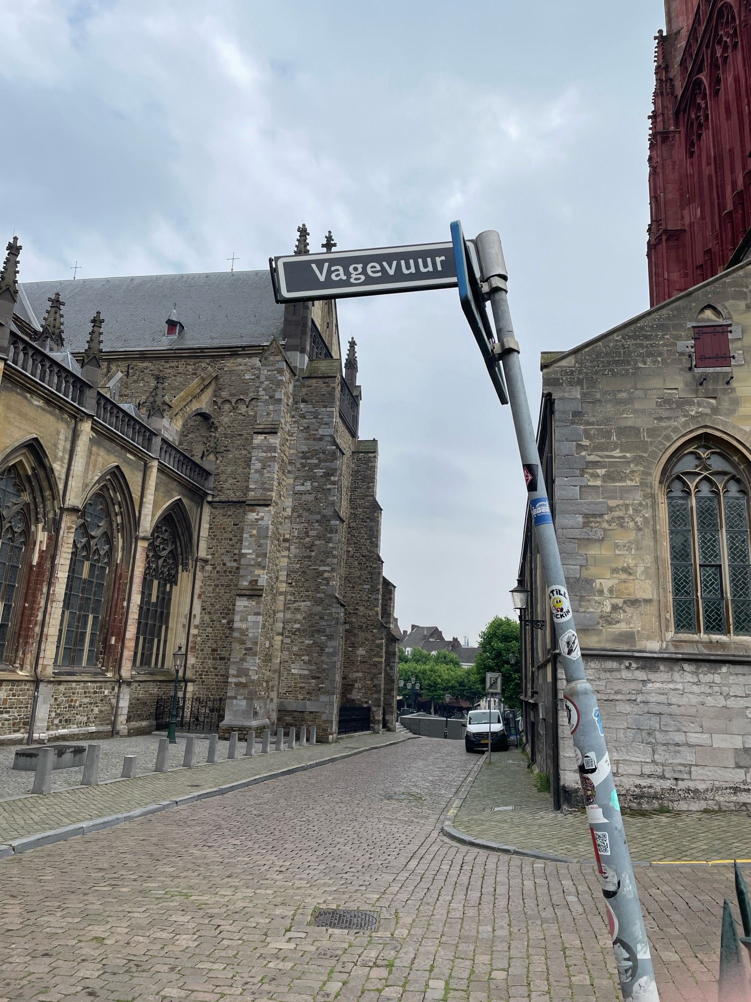 Roadsign directing to ‘purgatory’ next to a church in Maastricht