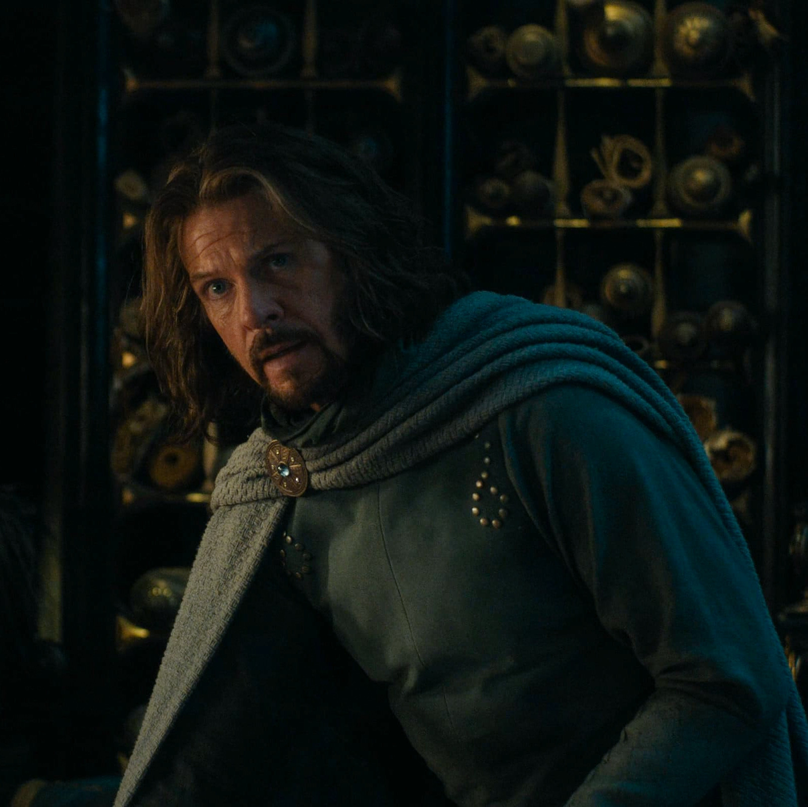 a screenshot of lloyd owen as elendil in the rings of power season 2 episode 8. he's looking up at the camera, and at míriel who is out of view, in the same scene where he was trying to convince her to escape with him