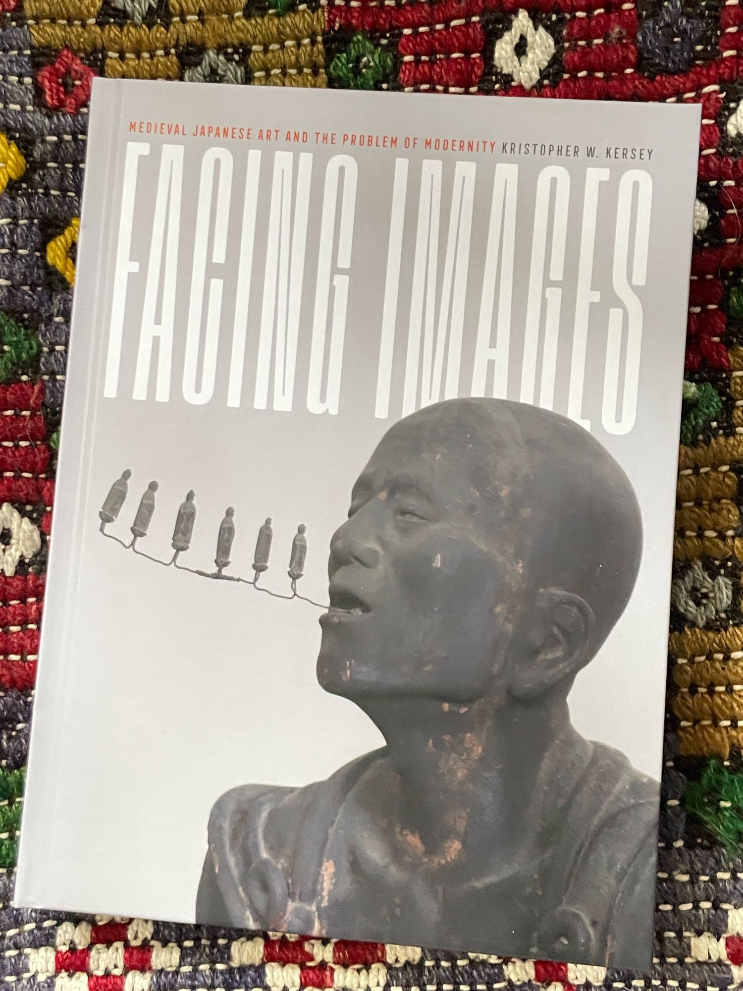 front cover of a book with an image of a medieval Japanese sculpture by Kōshō