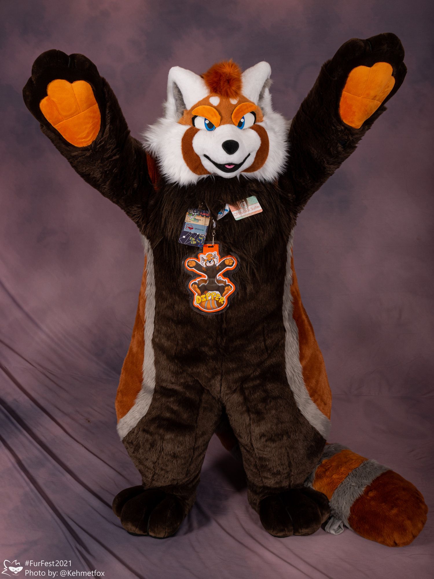 Plush Red panda fursuit with angry eyelids holding his hands up