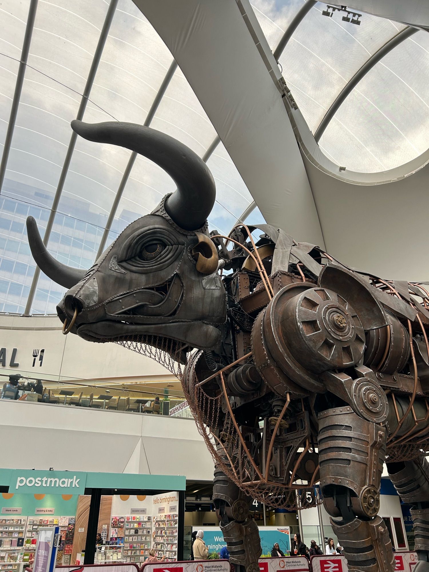 “Ozzy the Bull”, a large moving mechanical sculpture which featured in 2022’s Commonwealth Games, on display in Birmingham New Street station