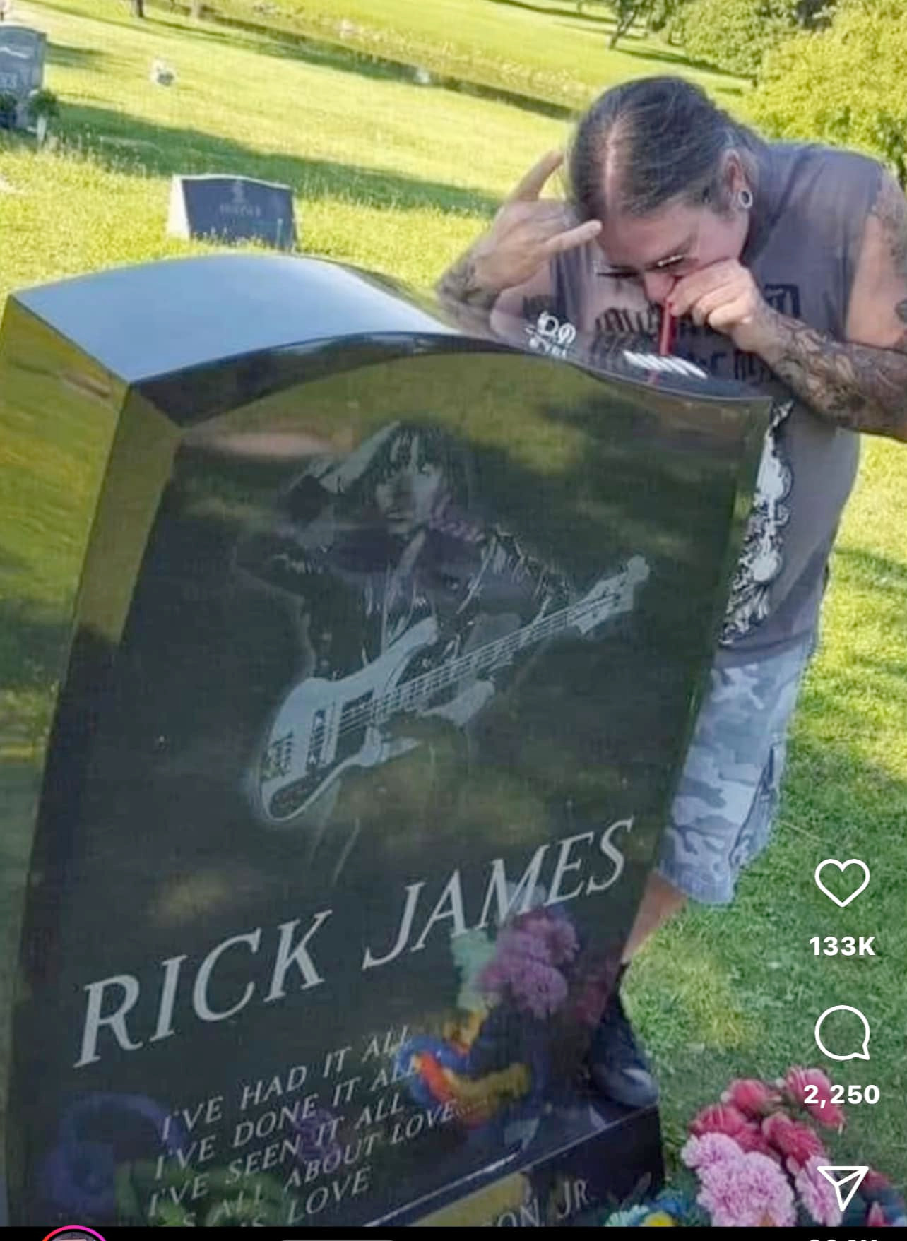 A man doing cocaine off the tombstone of Rick James that reads

"RICK JAMES

I'VE HAD IT ALL
I'VE DONE IT ALL 
I'VE SEEN IT ALL 
IT'S ALL ABOUT LOVE
GOD IS LOVE"