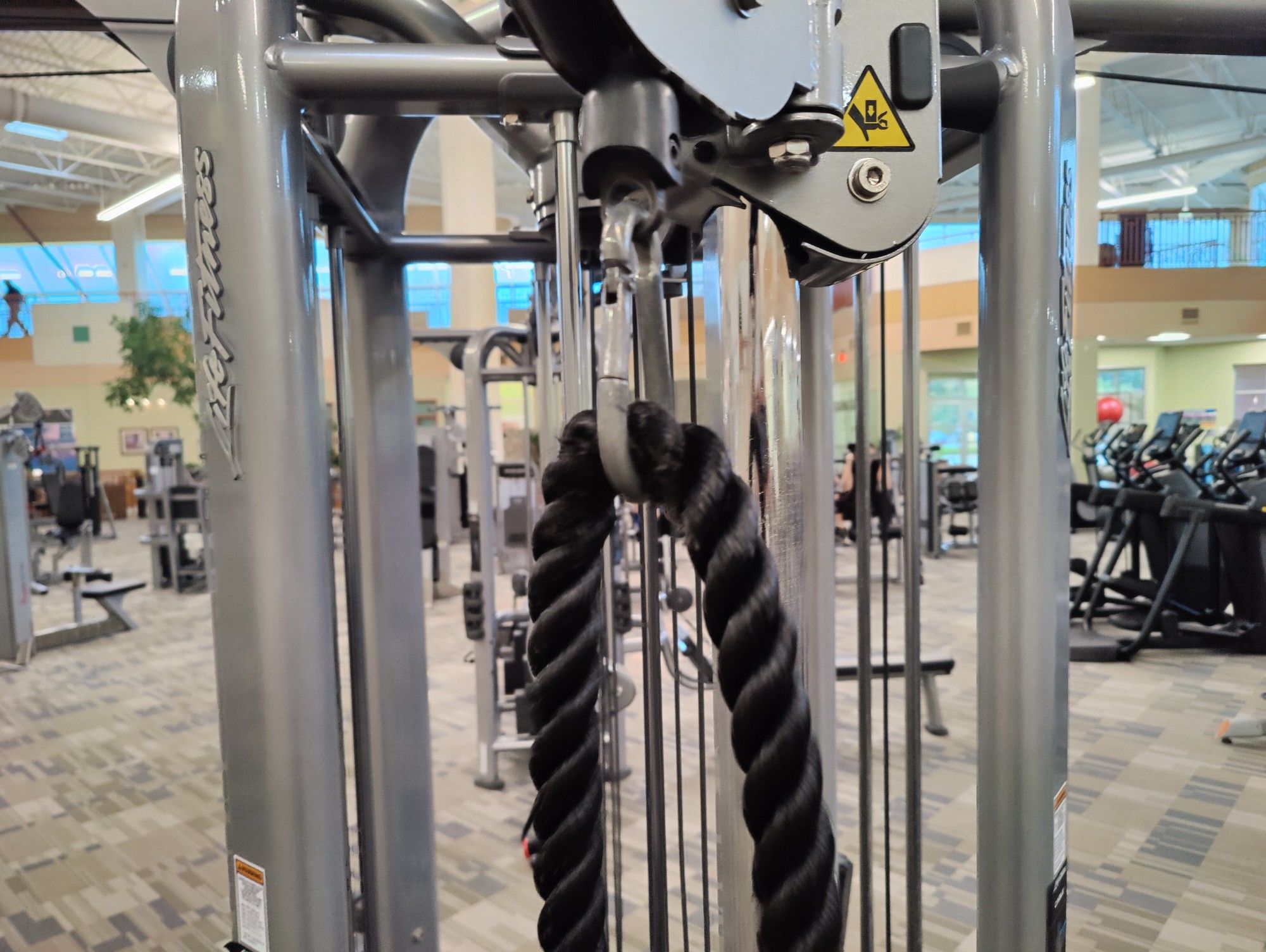 A rope pull attachment that someone put through a carabiner on the cable machine instead of using the loop, rendering it completely trapped