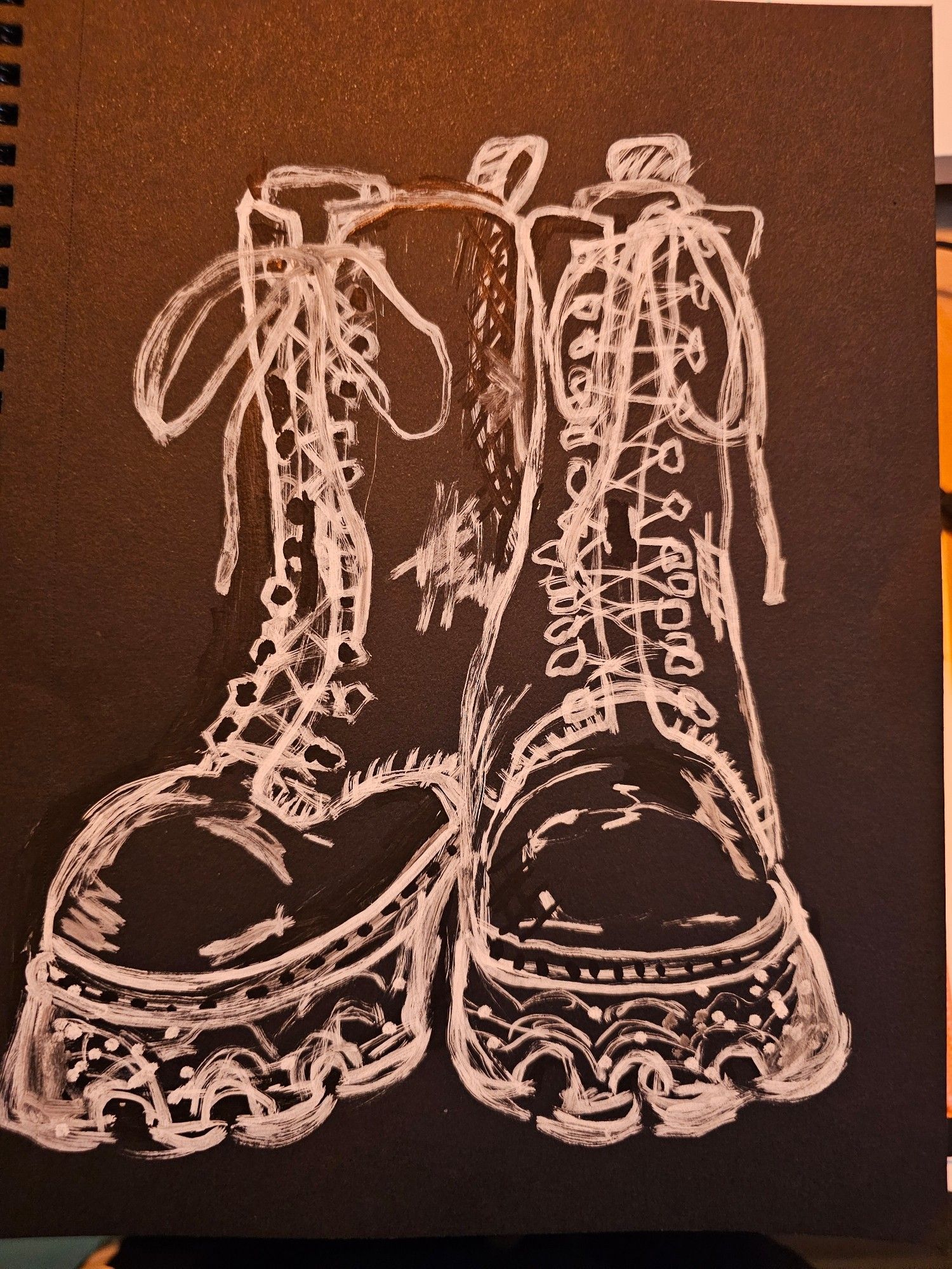 A drawing of Adolin's favorite pair of old stompy boots. Done with white poscamarker on black paper.