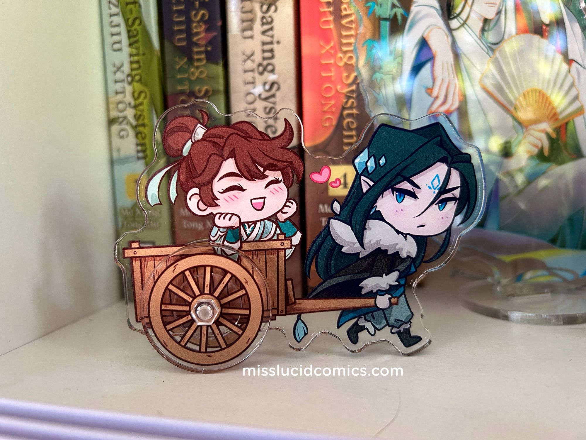 Mobei jun carrying cart holding Shang Quingha acrylic stand. The wheels are separate pieces so it’s like a moshang hot wheel