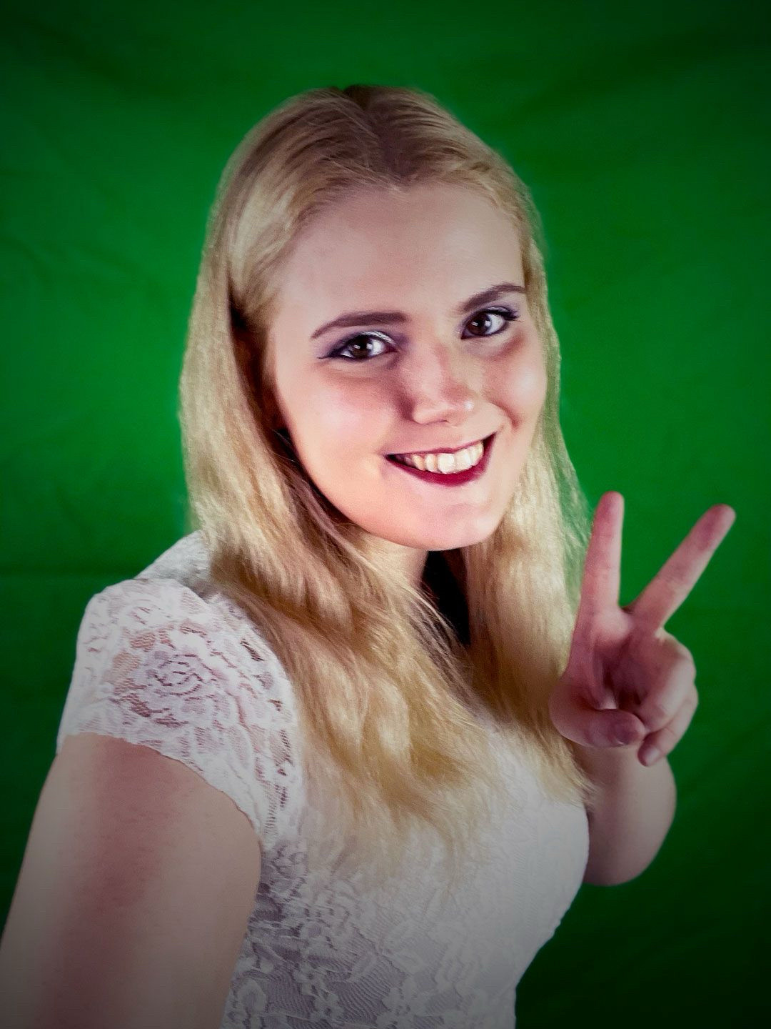 Tara St Michel selfie in front of a green screen