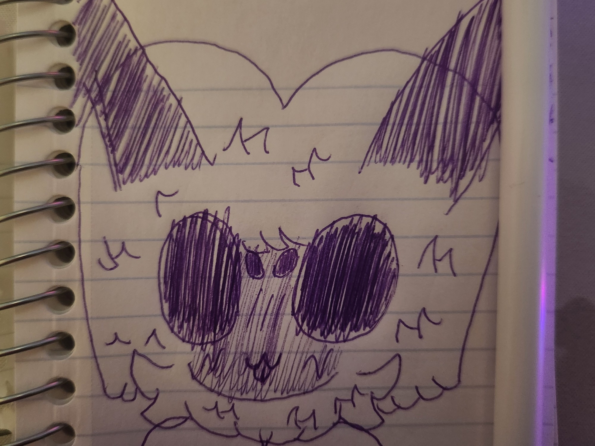 A notebook doodle in purple ink of the head of a bee fursona. Her eyes are angular and completely black, with two smaller eyes between them. Her hair is brightly colored and big and poofy with two antennae sticking out. She also has fluff around her neck the same color as her hair.