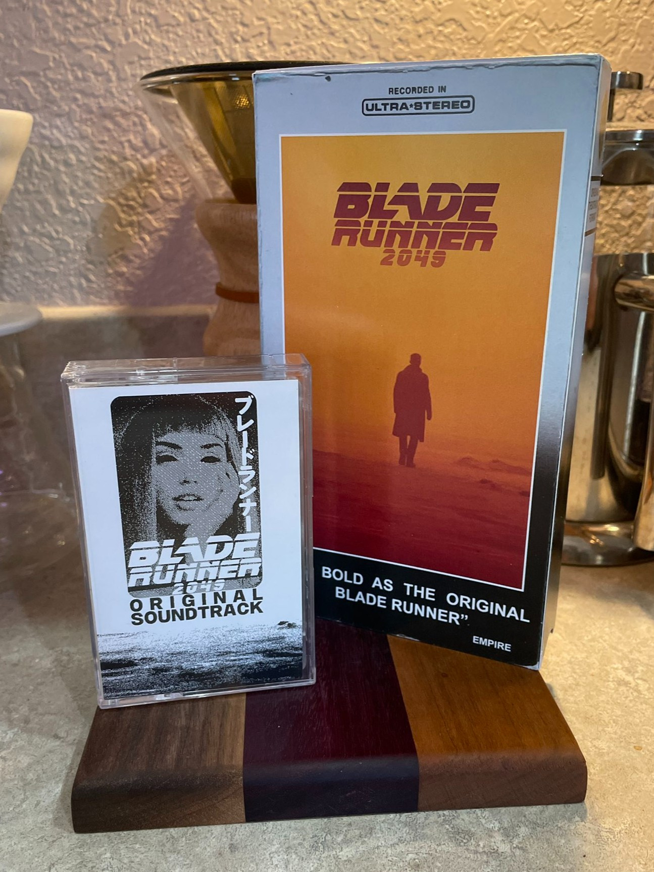 A Cassette of the Blade Runner 2049 soundtrack on the left and a VHS of Blade Runner 2049 on the right