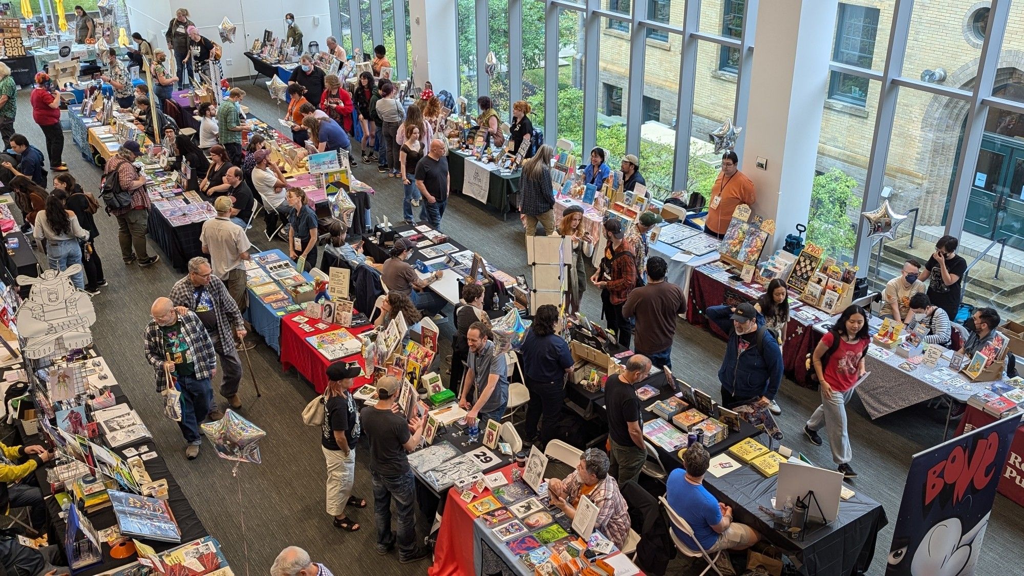 Panoramic view of CXC 2024's show floor. Rather small in size compared to other comic cons, but this is also not your average comic con either. Many indie offerings and artists showing up.