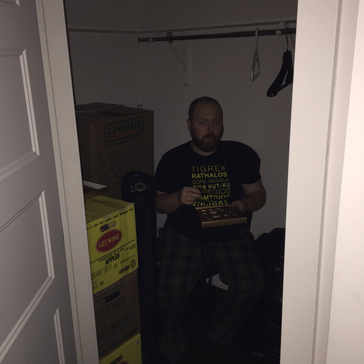 Pat Boivin, aka Pat Stares At, "caught" sitting in a closet eating candies like he's a gremlin.