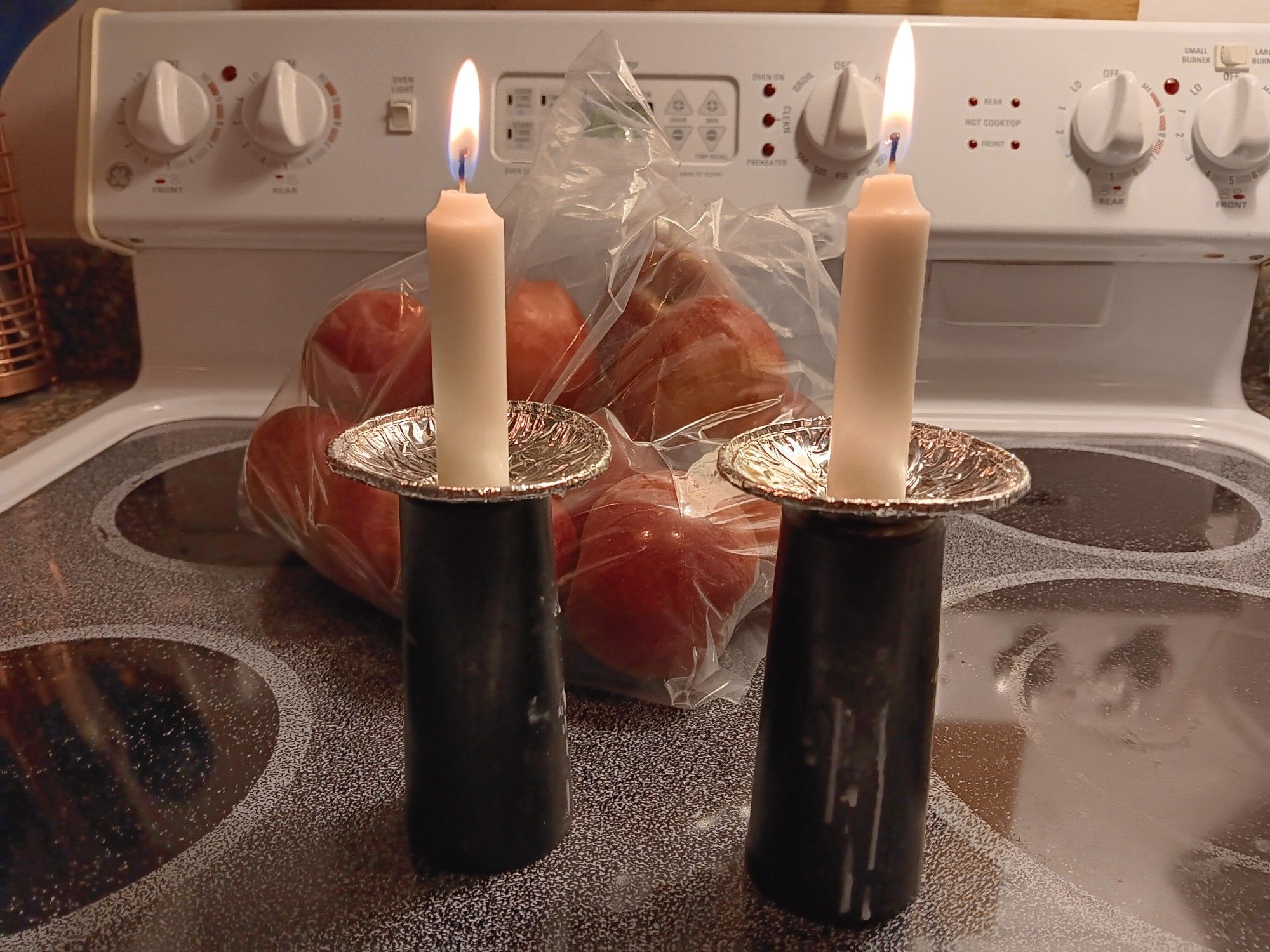 candles and a bag of apples