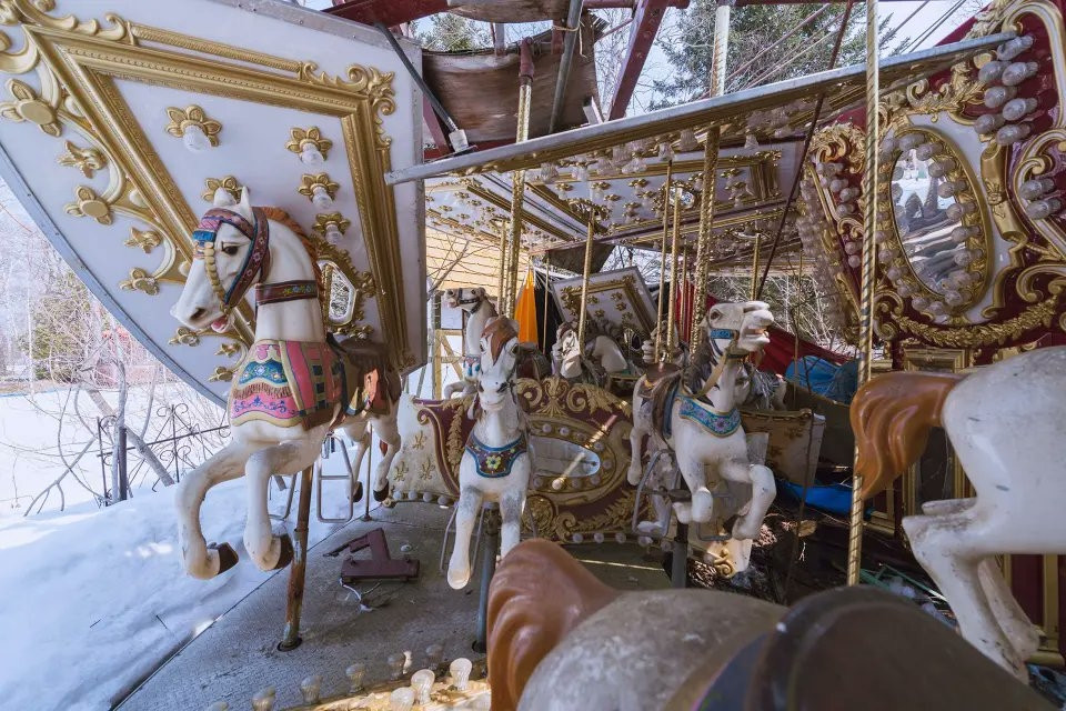 Photograph of an abandoned carousel.