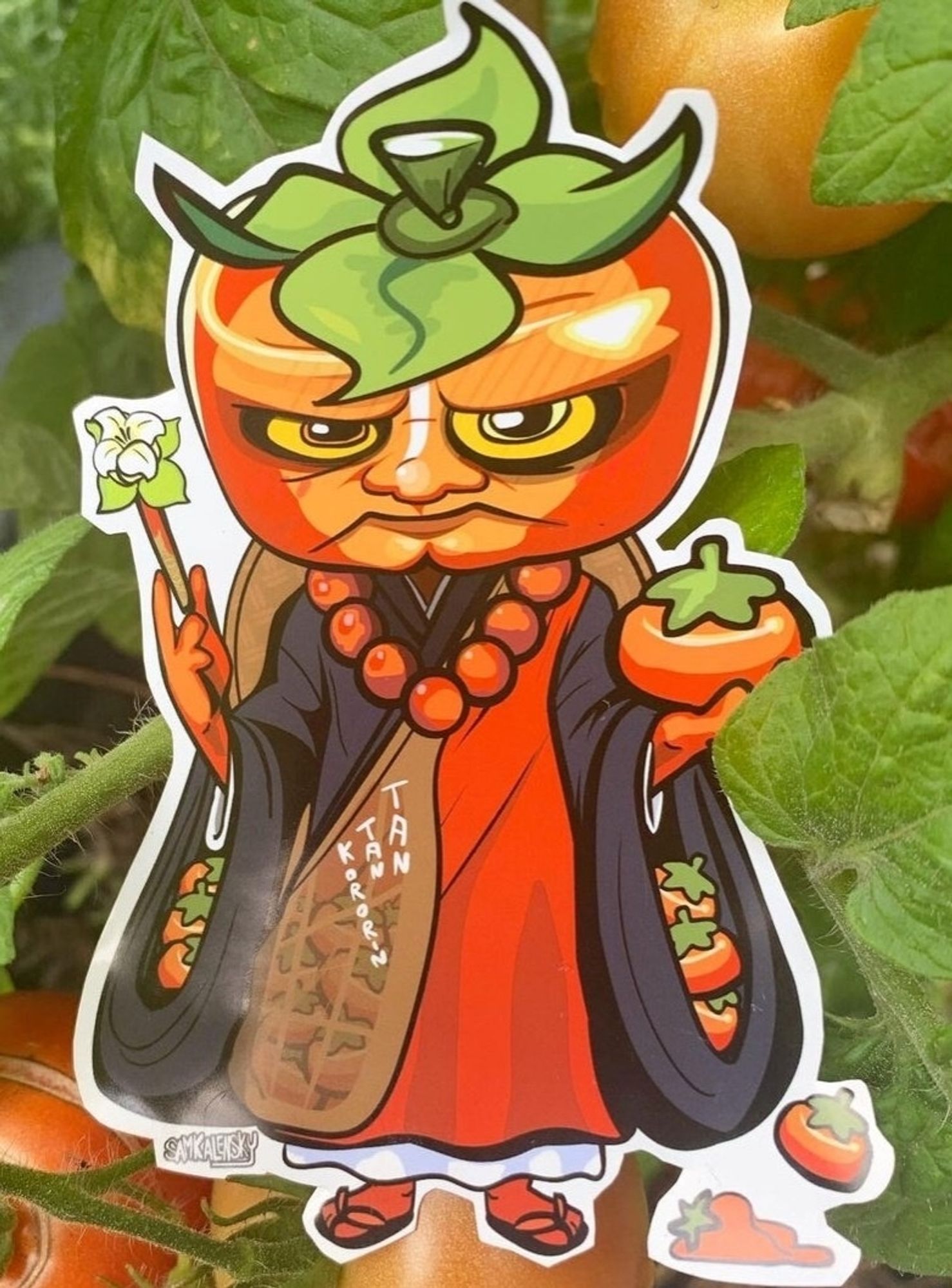 A creature with a persimmon for a head is dressed in monks robes. There are persimmons in his sleeves and he also holds one in his hand.