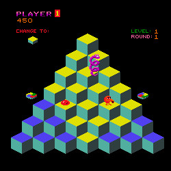 Cubes stacked in a pyramid of sorts? It’s Qbert if that helps - a little orange blob of a guy with a tendril-like nose who hops up and down these pixelated cubes. It was an old arcade game, very colorful. Very weird.