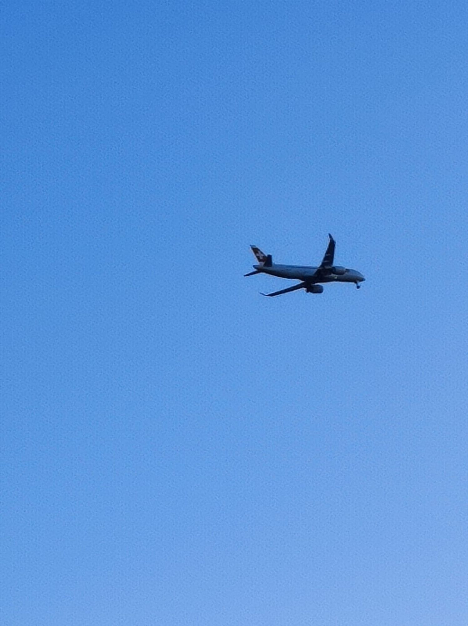 Swiss airplane against the sky, preparing for landing in Nice