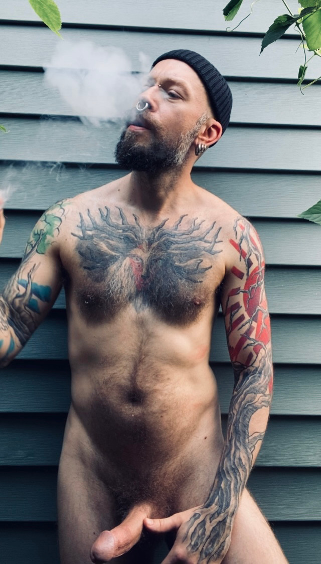 Smoking behind my shed with my cock hard. 