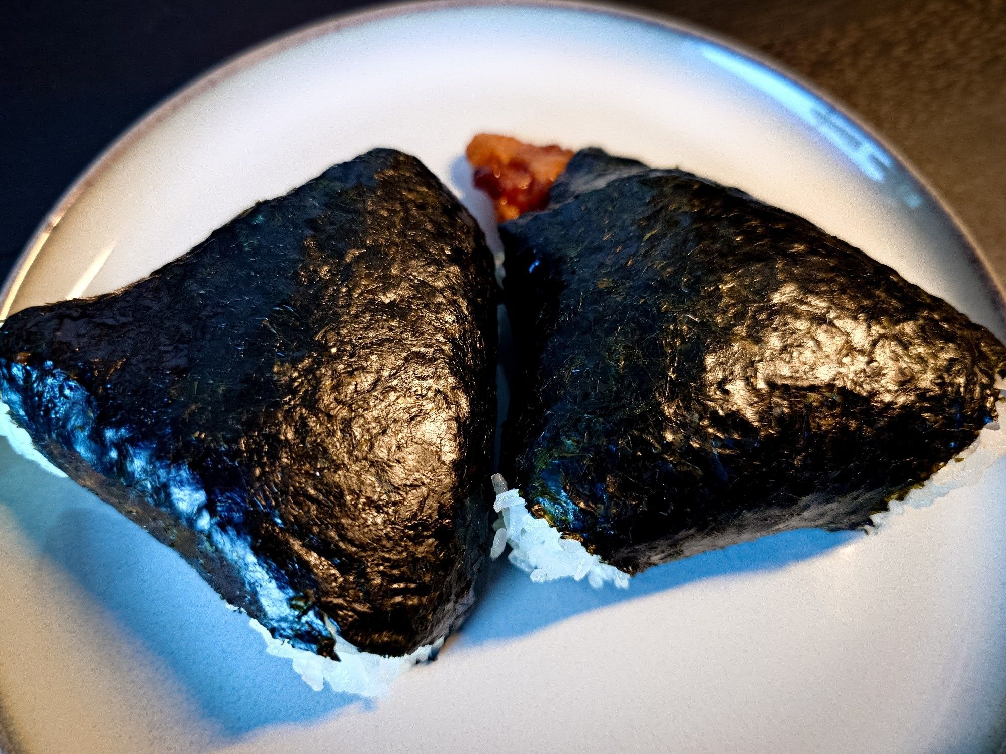 Onigiri is japanese riceballs wrapped in seaweed, mine have rice and salmon and rice and shrimp, i got two. They are pretty large, size of a bun or so