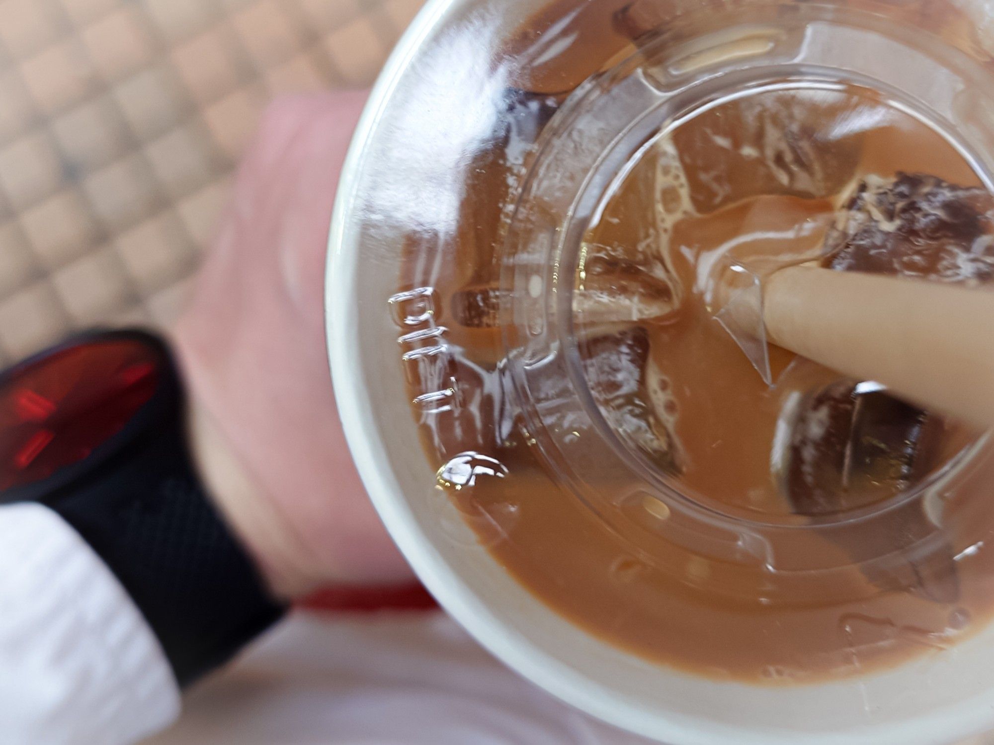 Just me holding a large cup of latte, wearing a white shirt and a red watch