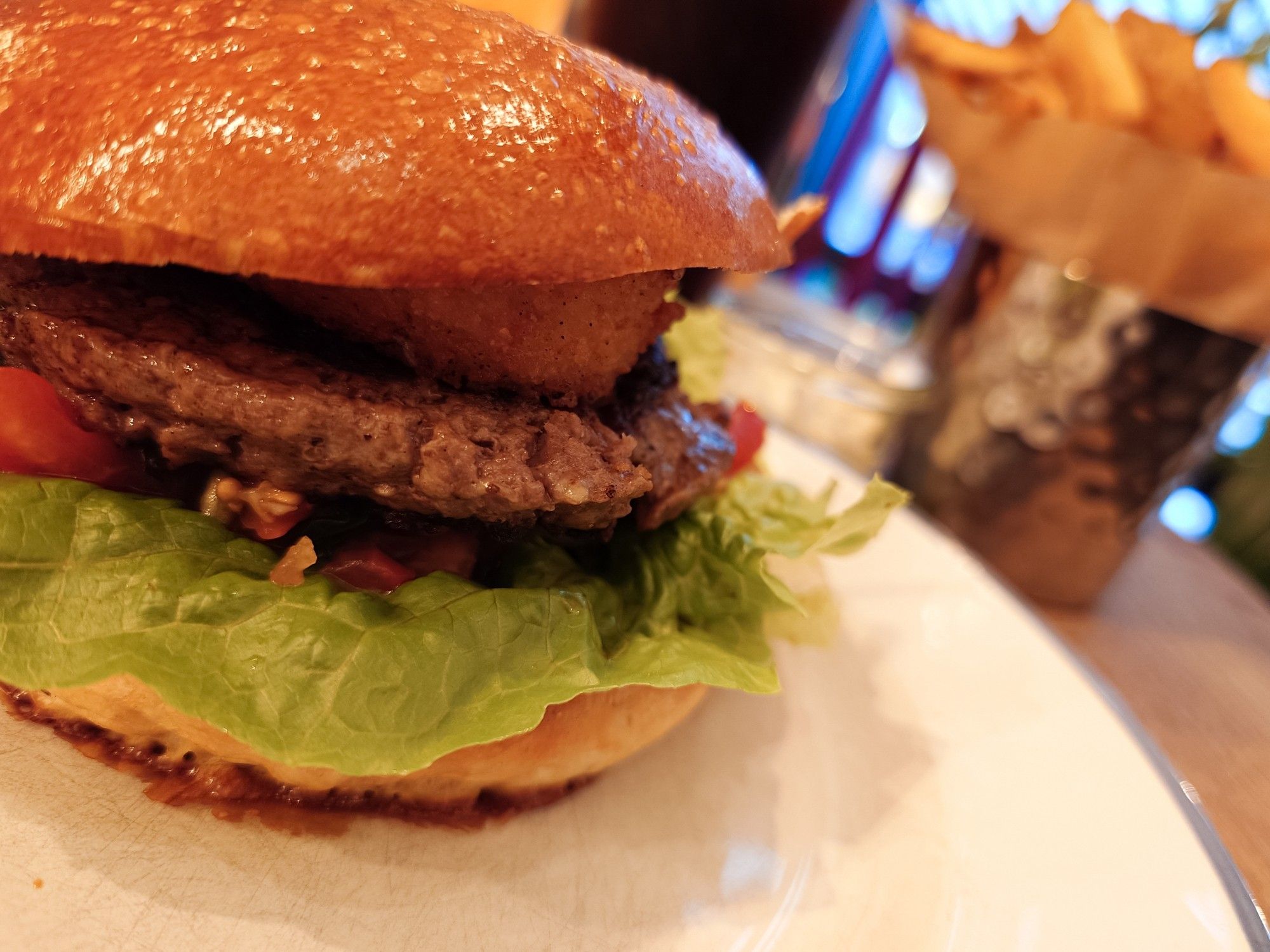 Burger next to thick fries and some truffle mayo