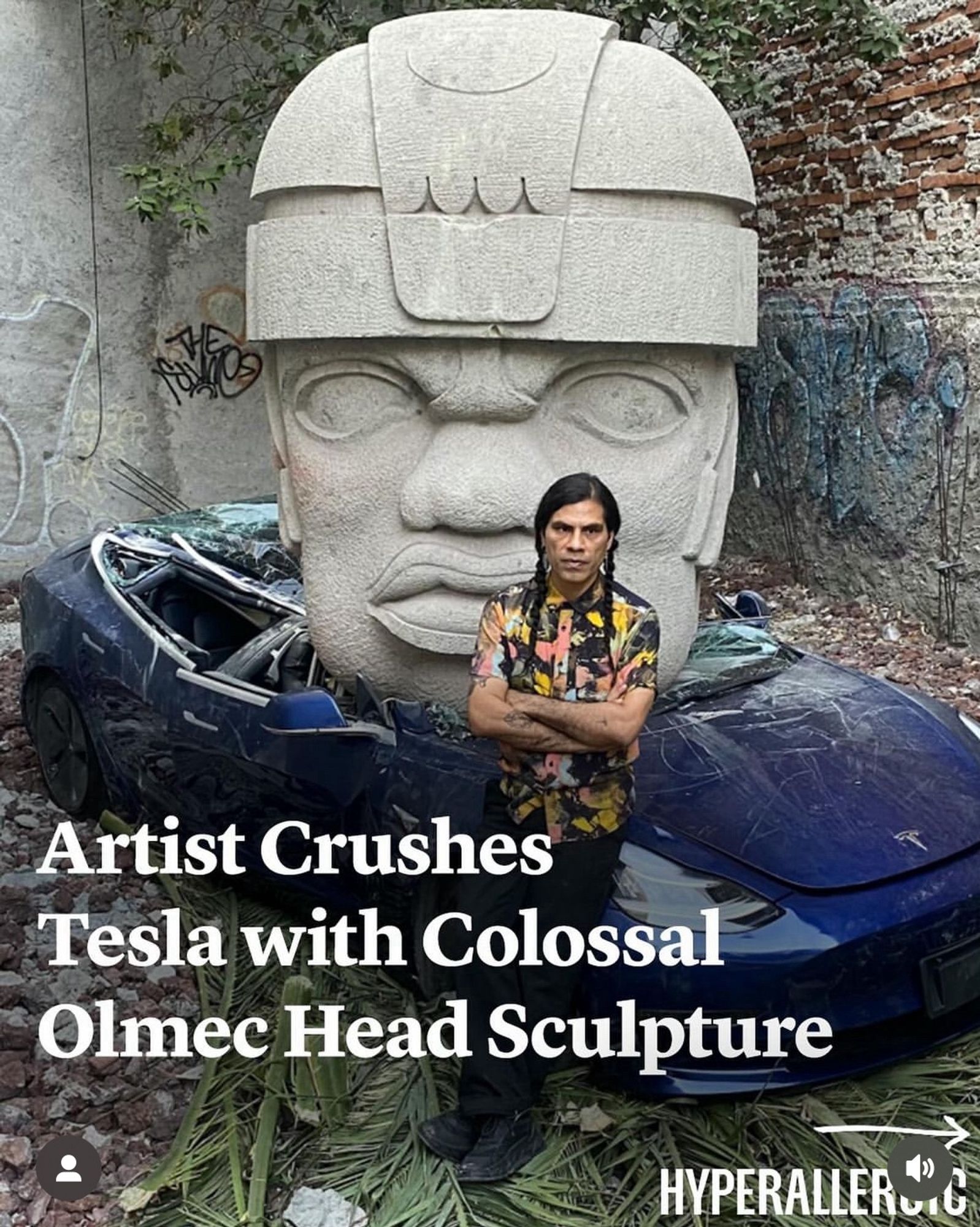 Artist crushes tesla with colossal olmec head sculpture