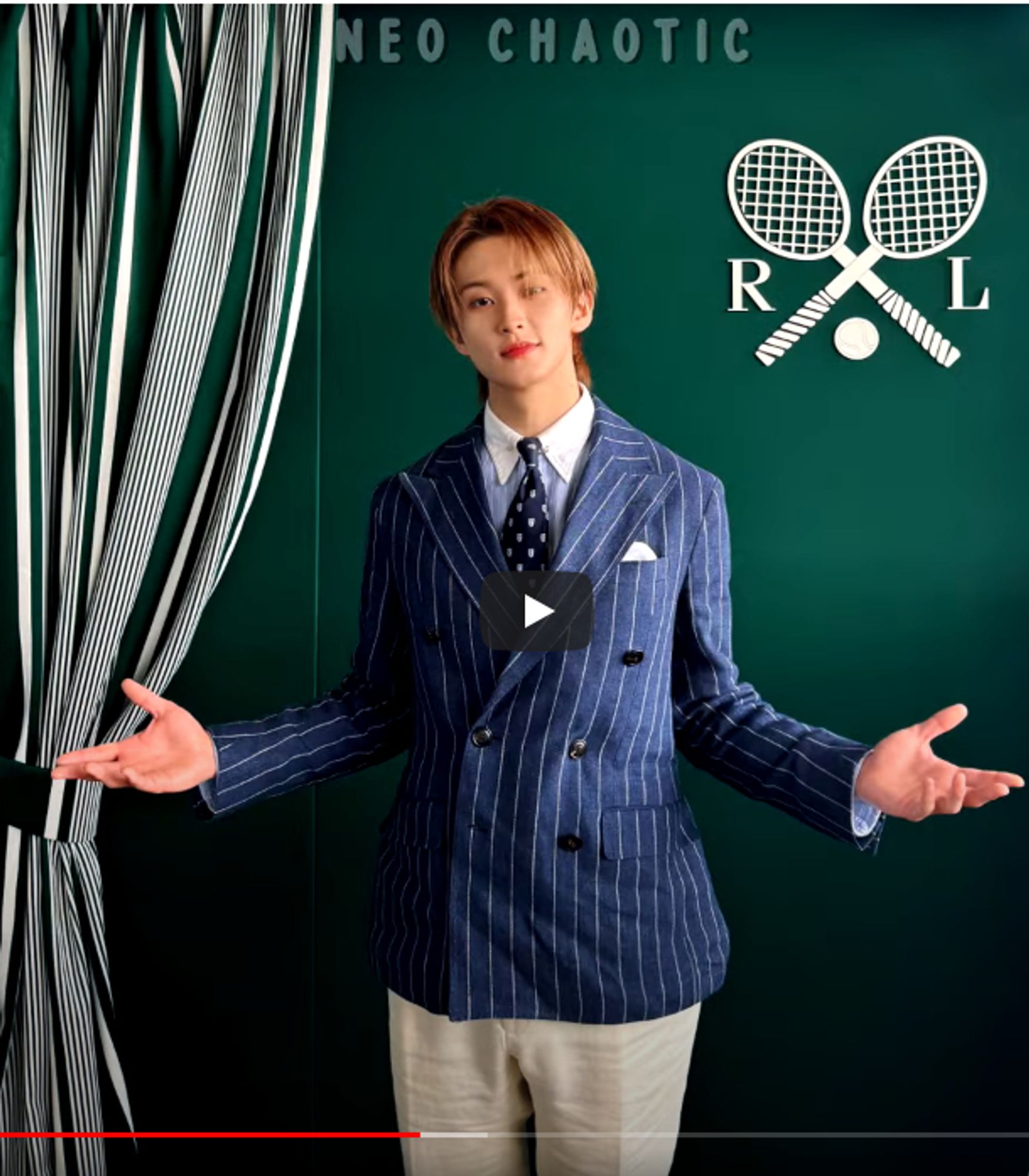 Mark Lee in a preppy pinstripe suit, posing at Wimbledon 2024