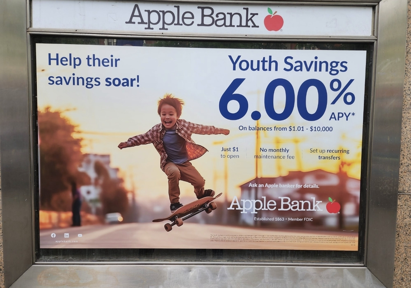 an ai image of a young boy skating on a skateboard that can't function or exist with hands that look like trees advertising on a bilboard for Apple Bank