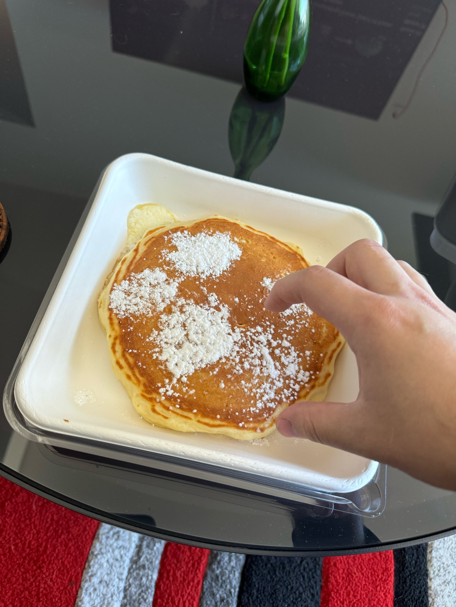 grizzly reaches for pancake