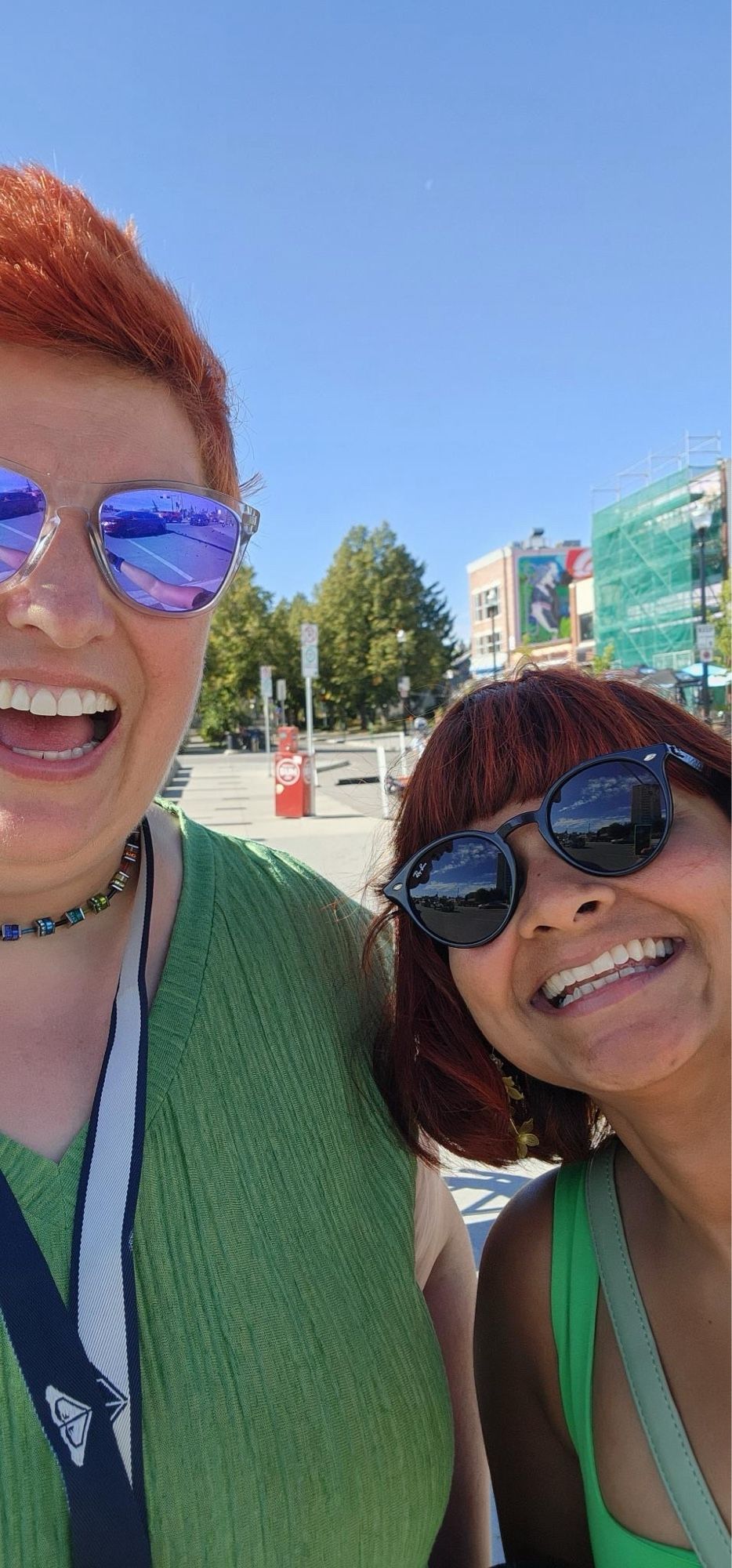 Clare and Swati both wearing green tops