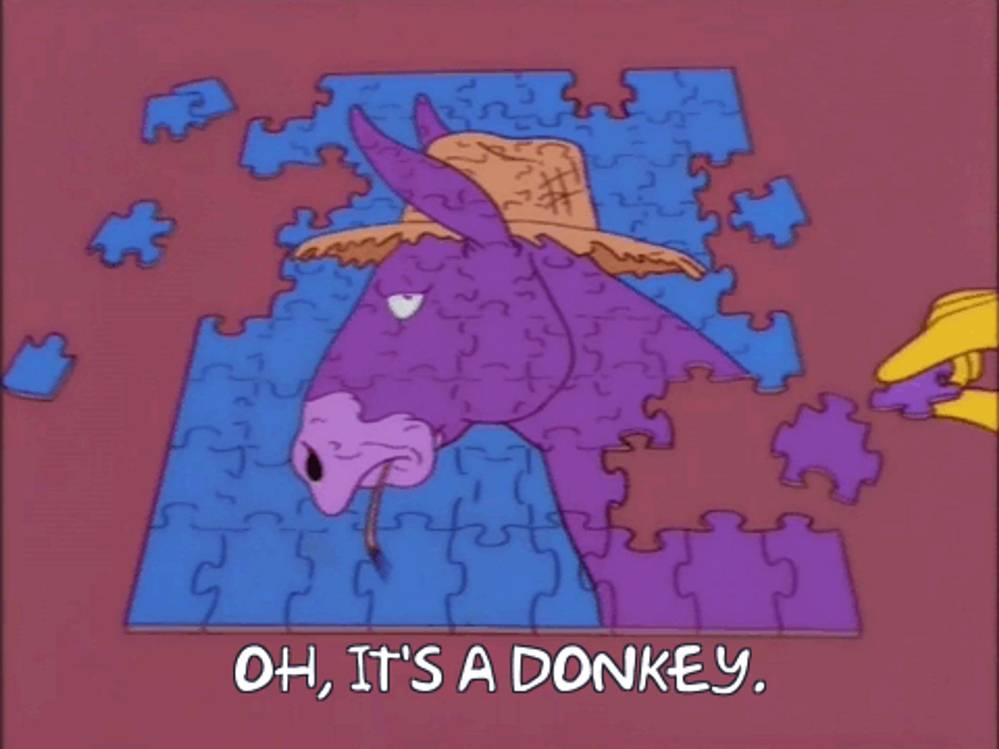 An animated gif from The Simpsons of a person putting together a jigsaw puzzle of a donkey. After the person places a piece, they say "Oh, it's a donkey"