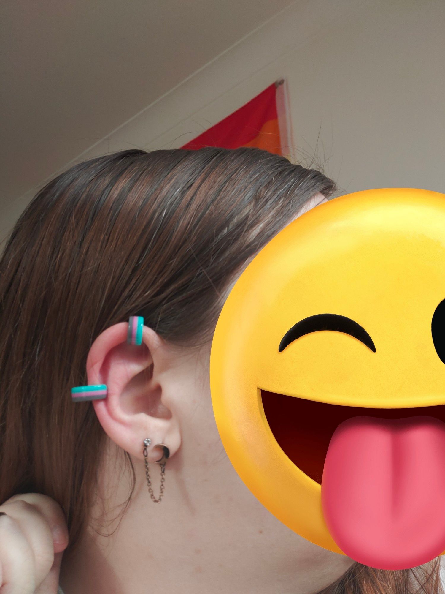 Picture of me facing the right showing my ear which has the two Miku Piit earcuffs; the smaller one on the top and the larger one to the side.